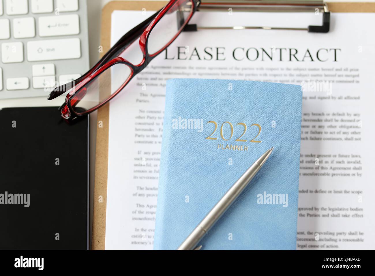 Lease agreement contract sheet, notebook planner for year, smartphone ...