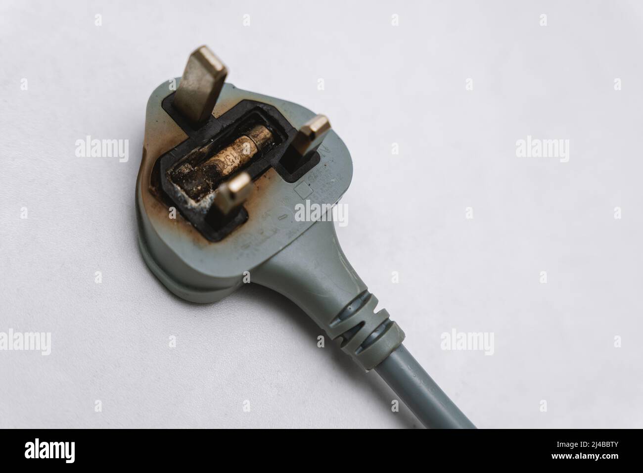 Broken and Damaged Burnt 3 Pin Plug Stock Photo