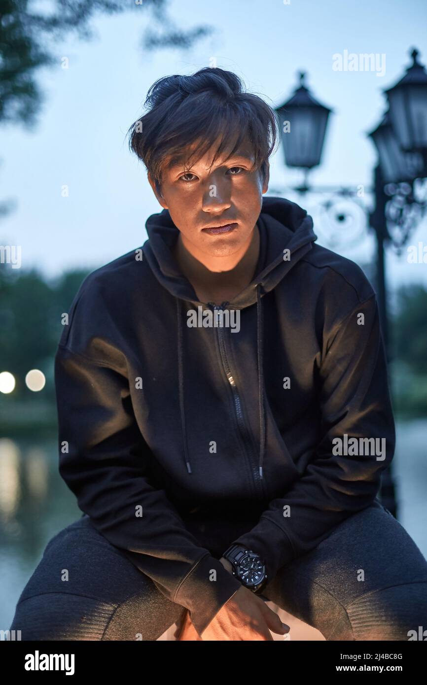 Outdoor portrait of a young Asian guy Stock Photo