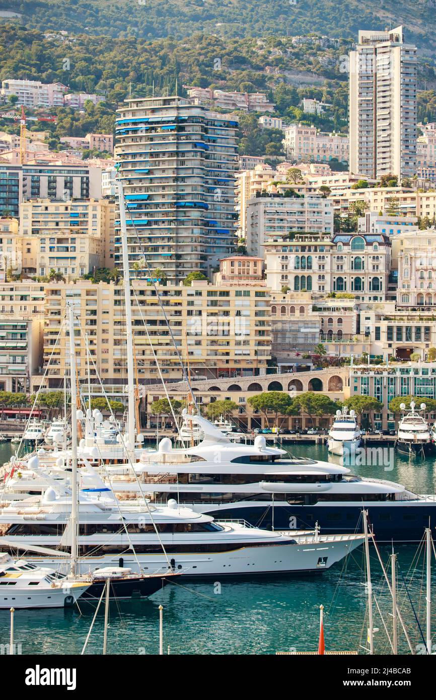 Aerial view of port Hercules at sunset, mega yachts are moored in marina  near yacht club of Monaco, view of city life from old town, a lot of mega  Stock Photo -