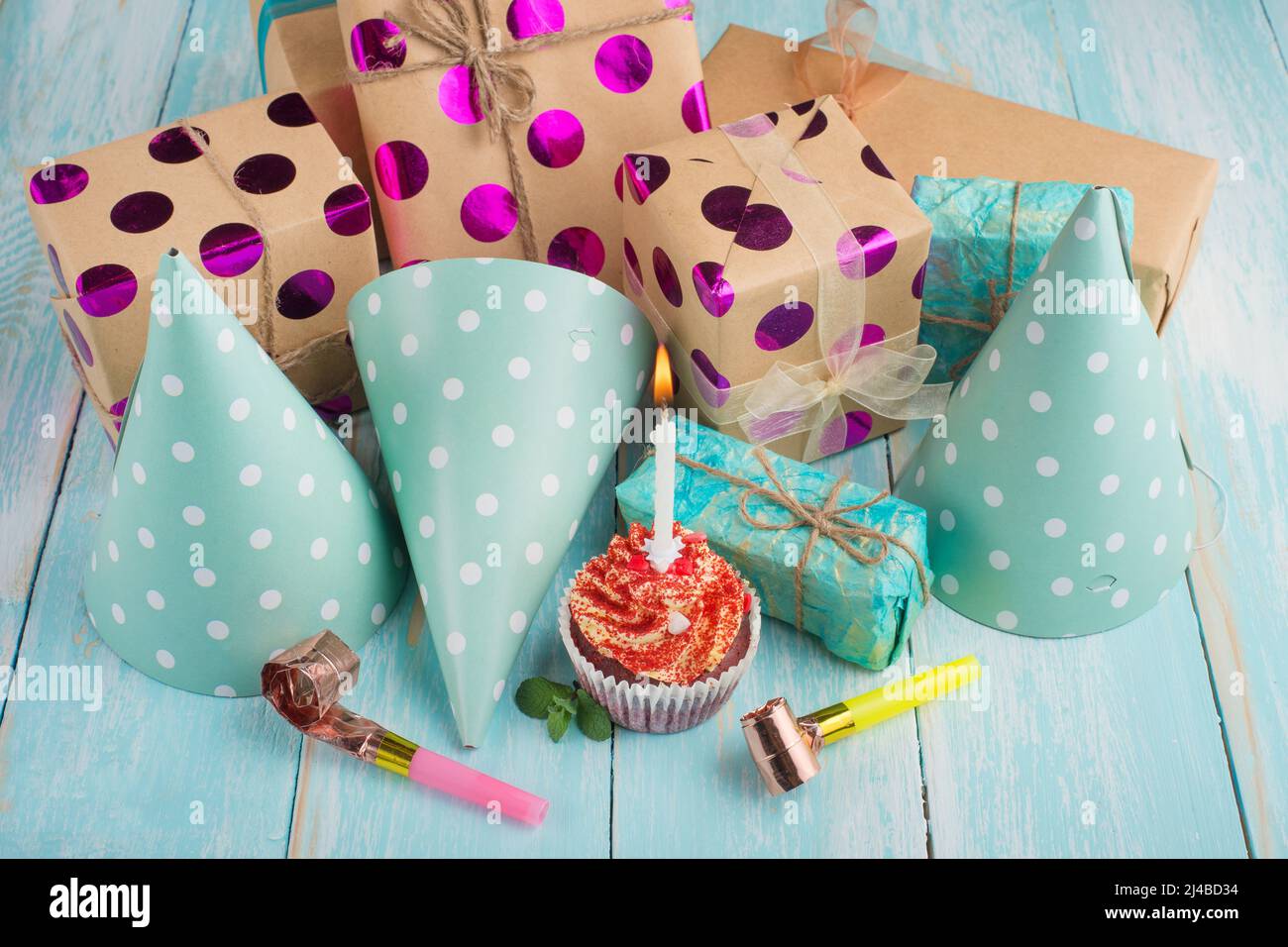 Birthday caps, blowers and confetti on background Stock Photo - Alamy
