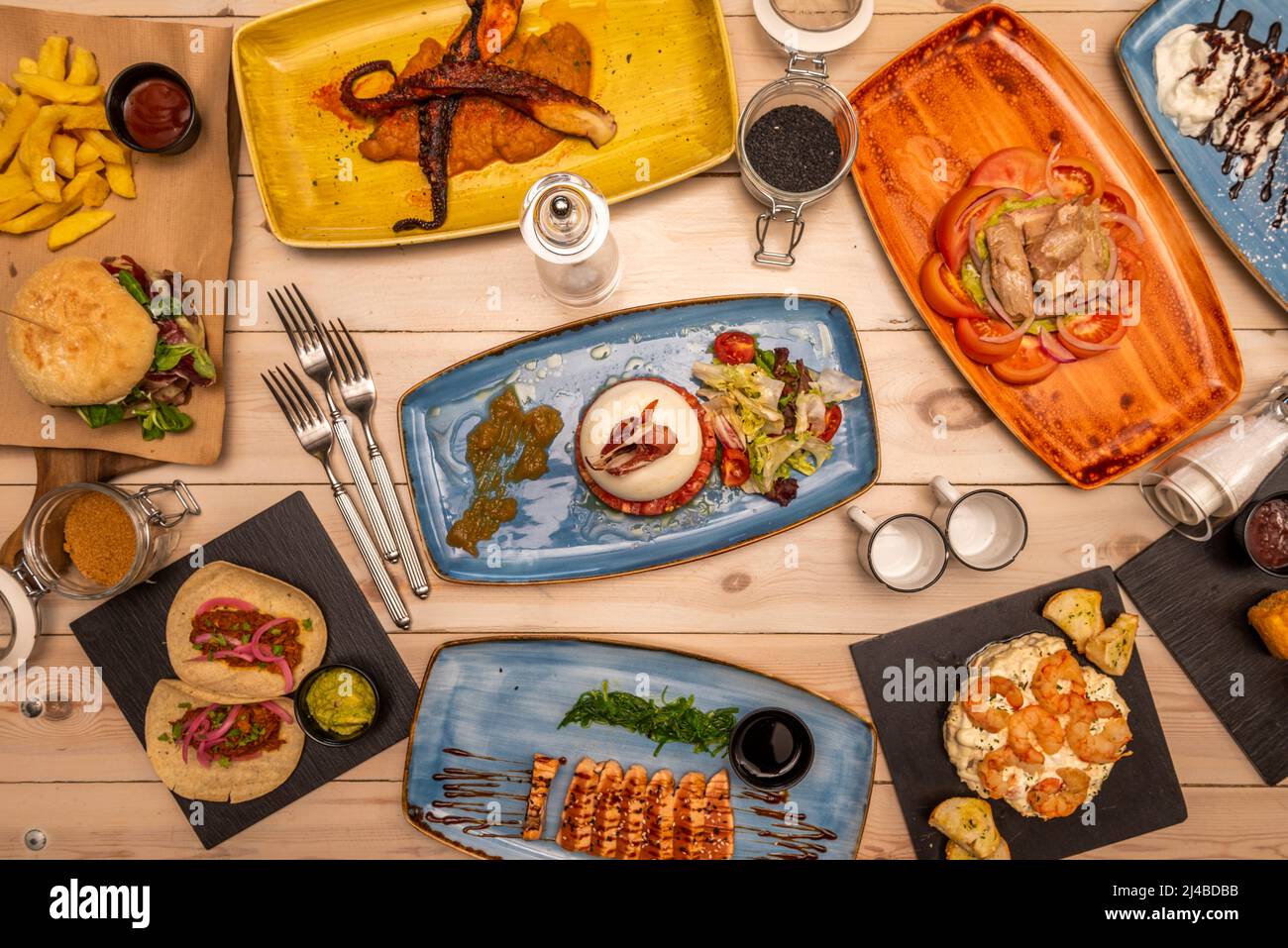 Set of international food dishes with mexican cochinita pibil tacos