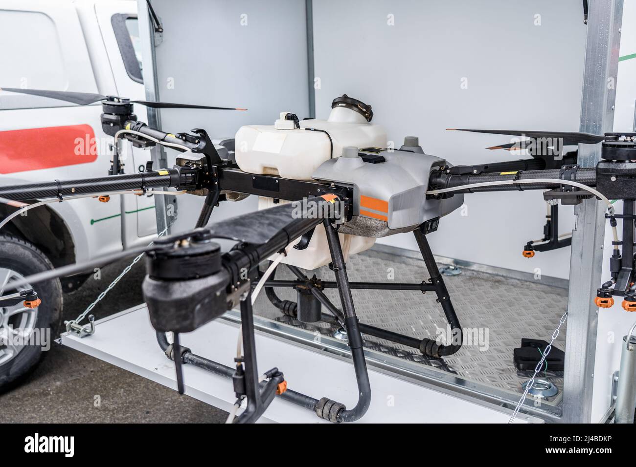 Special agriculture drone or quadcopter aircraft for working on sown fields, spraying and watering. Stock Photo
