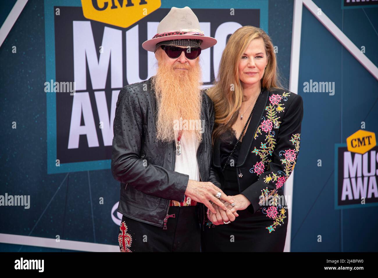 Nashville, Tenn. - April 11, 2022 Billy Gibbons of ZZ Top and wife Gilligan Stillwater arrives at the red carpet for the 2022 CMT Awards on April 11, 2022 at Municipal Auditorium in Nashville, Tenn. Credit: Jamie Gilliam/The Photo Access Stock Photo