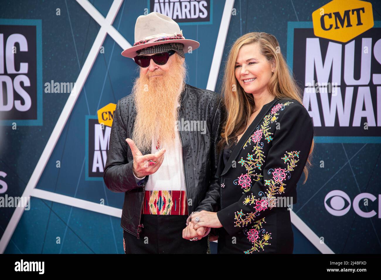 Nashville, Tenn. - April 11, 2022 Billy Gibbons of ZZ Top and wife Gilligan Stillwater arrives at the red carpet for the 2022 CMT Awards on April 11, 2022 at Municipal Auditorium in Nashville, Tenn. Credit: Jamie Gilliam/The Photo Access Stock Photo
