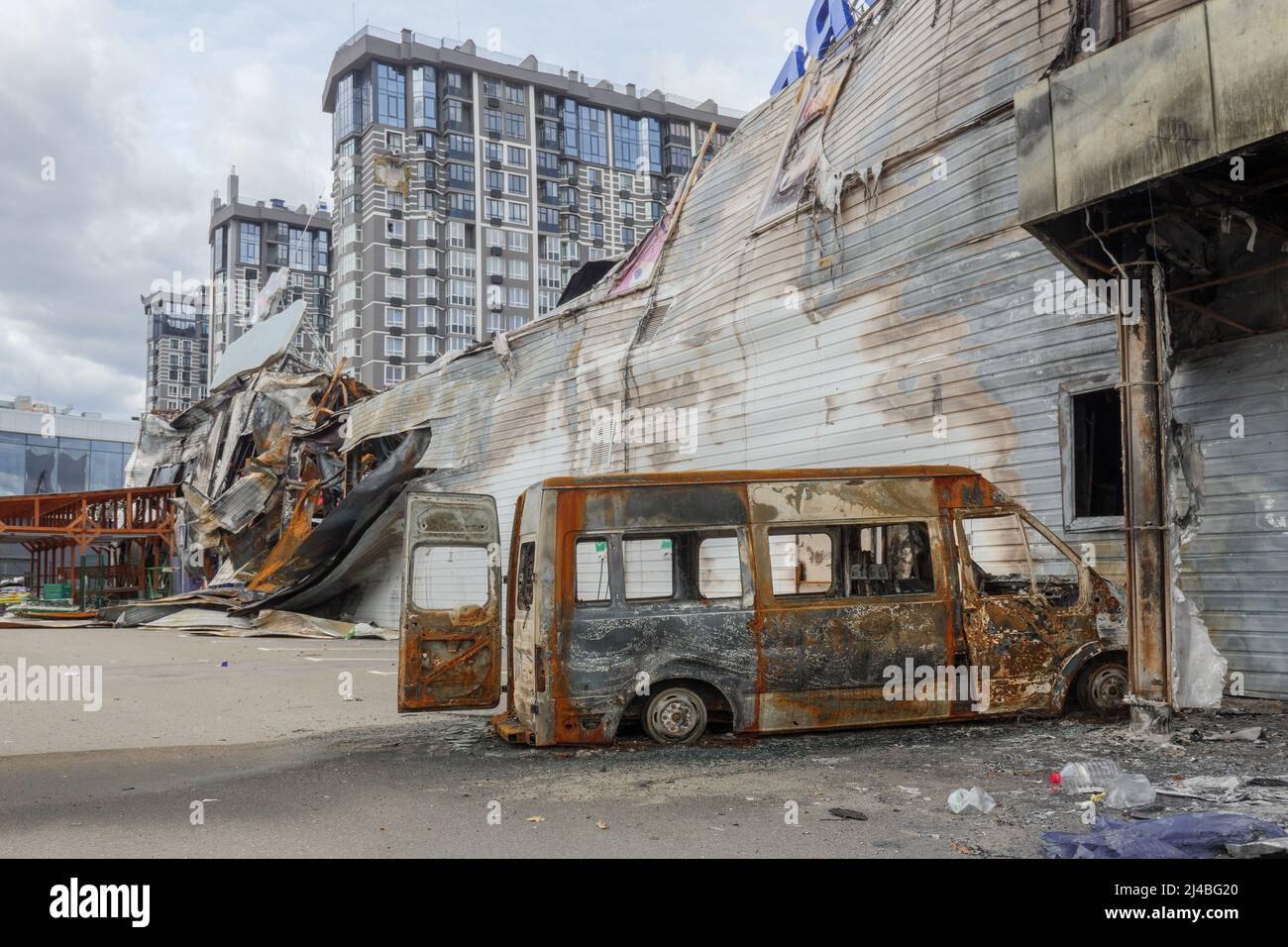 Bomb attack Russia war damage Ukraine war crime. Aftermath shell of civilian bombed city Bucha damage building destruction. 2022 Russian invasion of Stock Photo