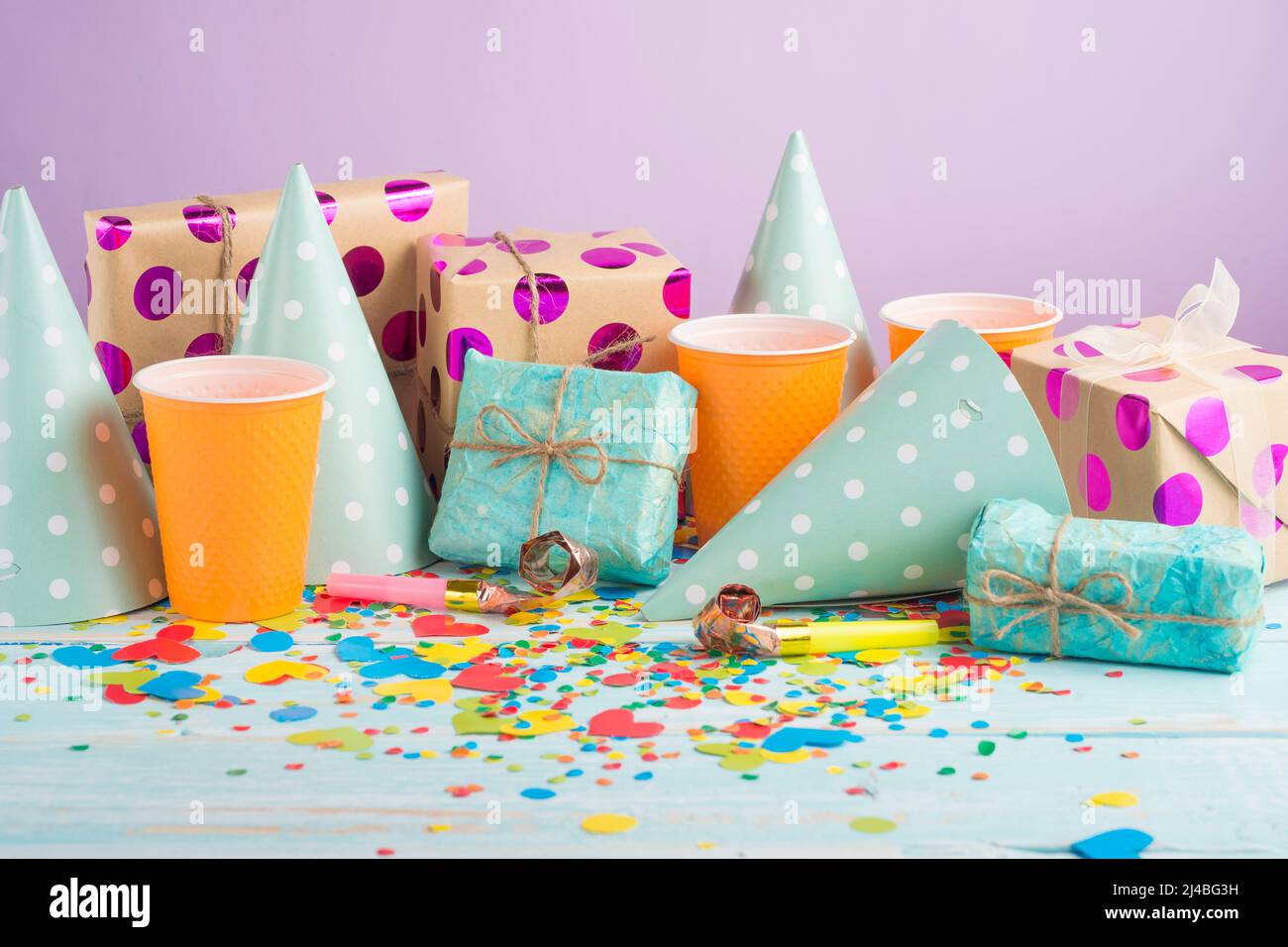 Birthday caps, blowers and confetti on background Stock Photo - Alamy