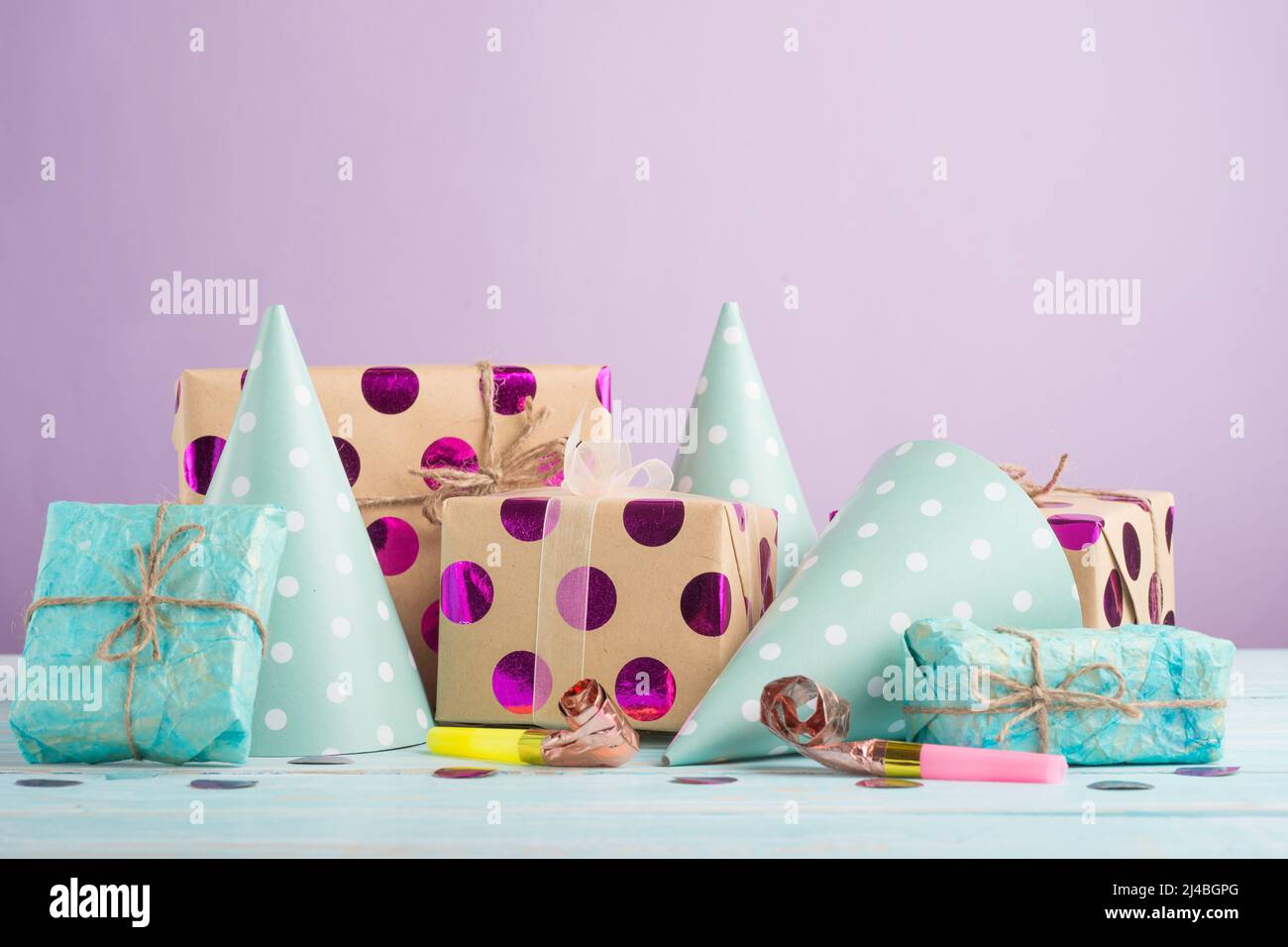 Birthday caps, blowers and confetti on background Stock Photo - Alamy