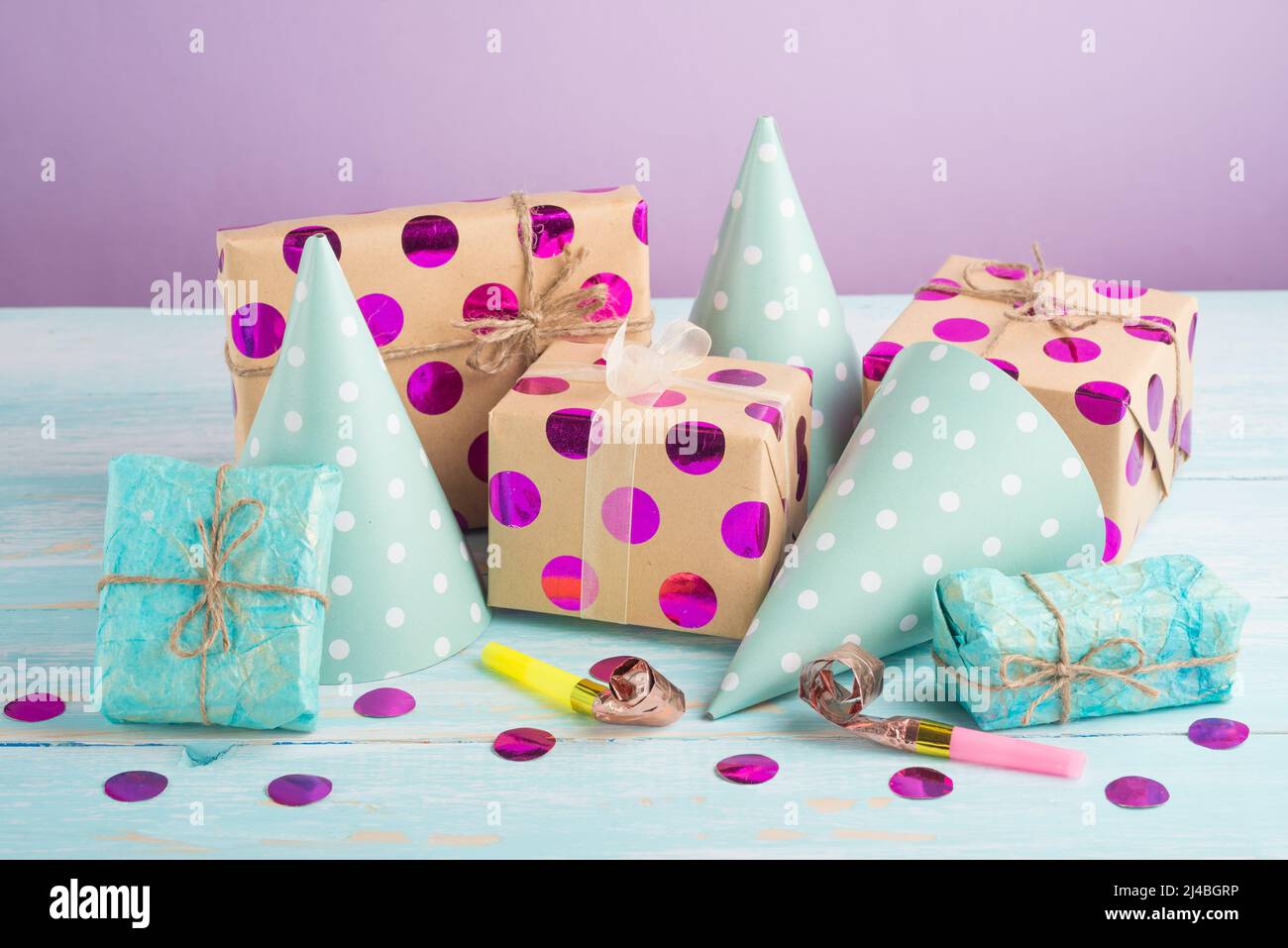 Birthday caps, blowers and confetti on background Stock Photo - Alamy