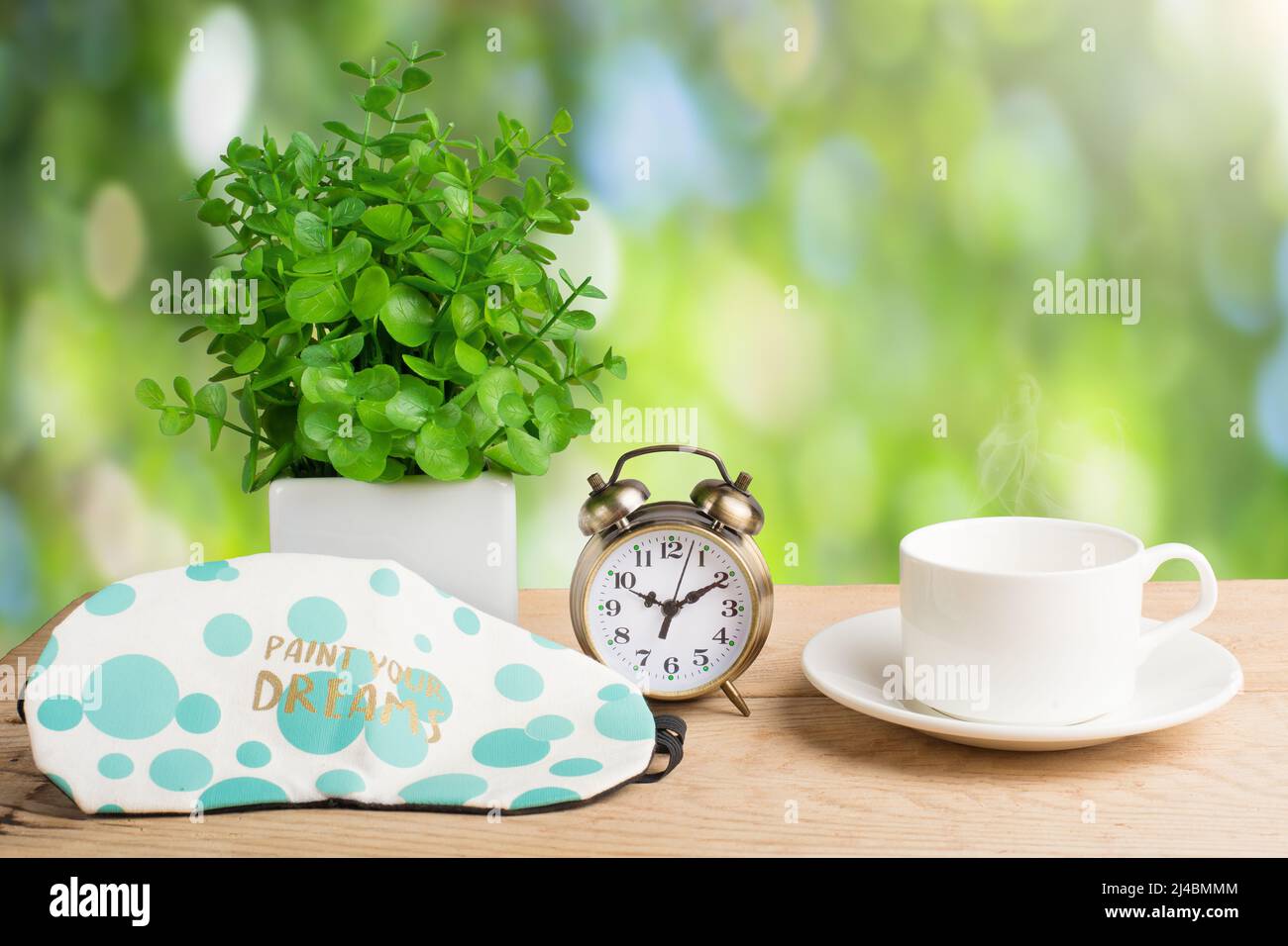 https://c8.alamy.com/comp/2J4BMMM/flower-alarm-clock-and-coffee-cup-morning-background-2J4BMMM.jpg