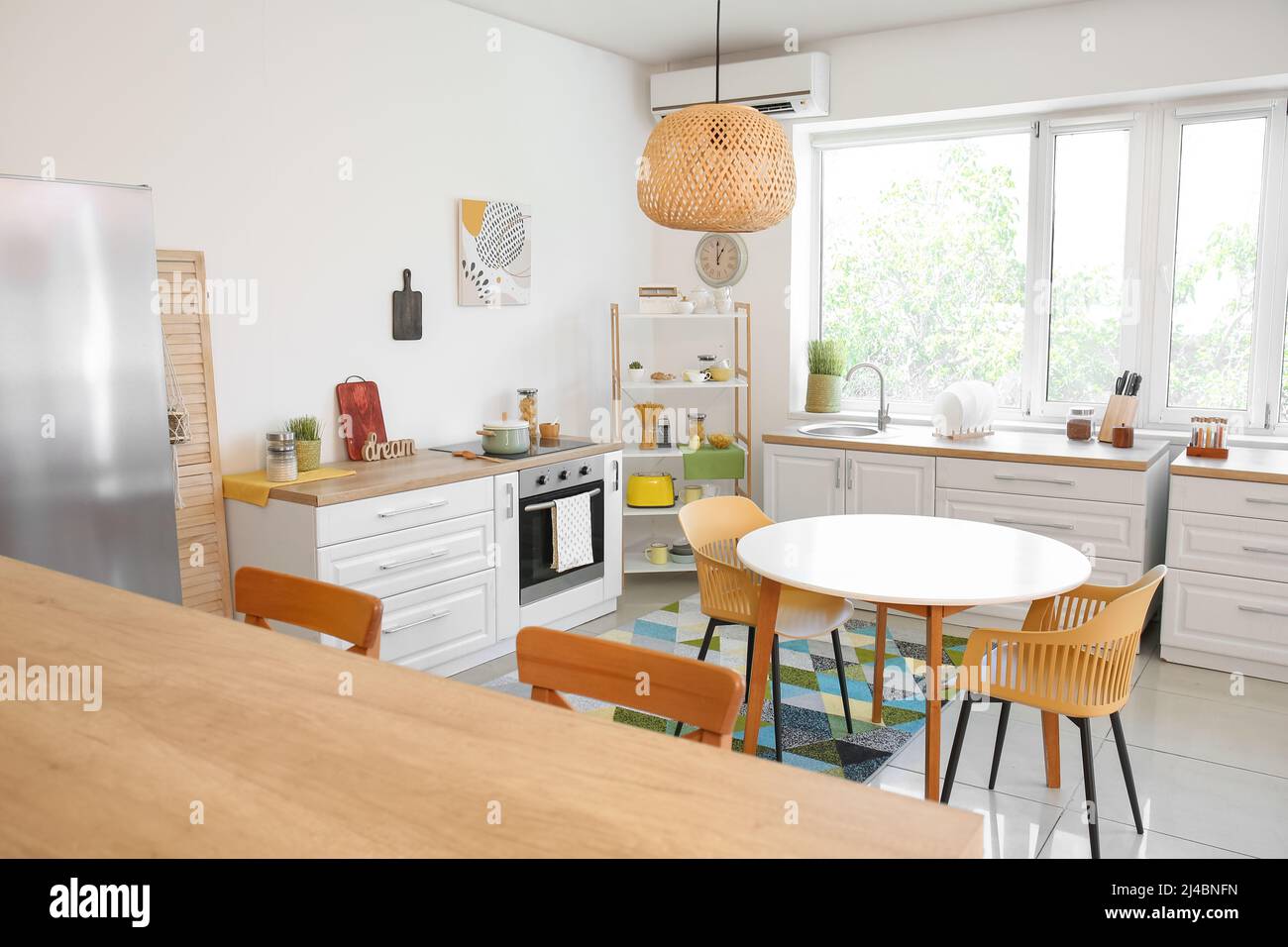 Dining table with chairs in modern interior of kitchen Stock Photo - Alamy
