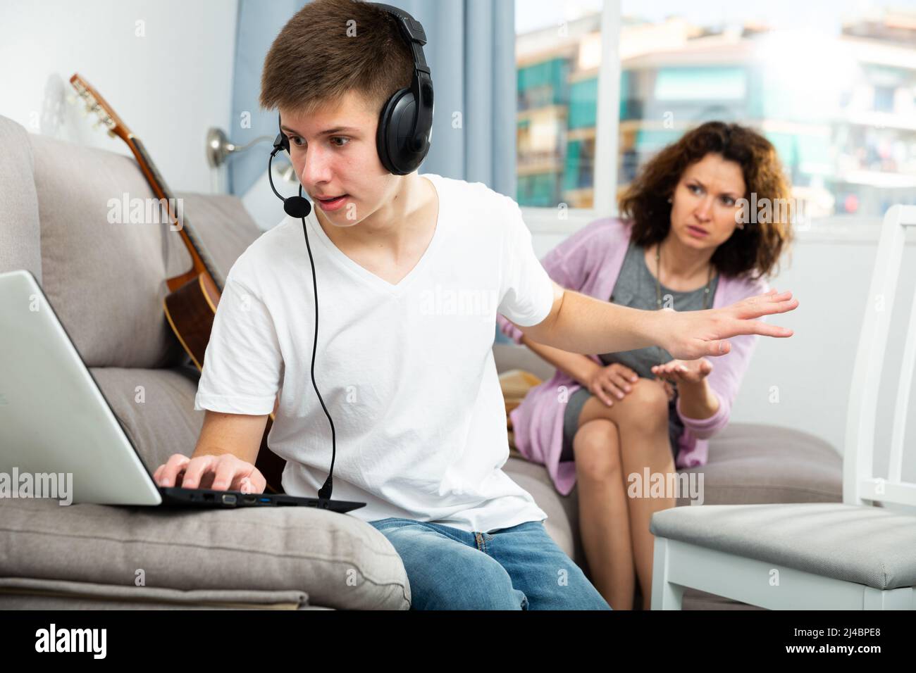 Teenager boy addicted with laptop Stock Photo - Alamy