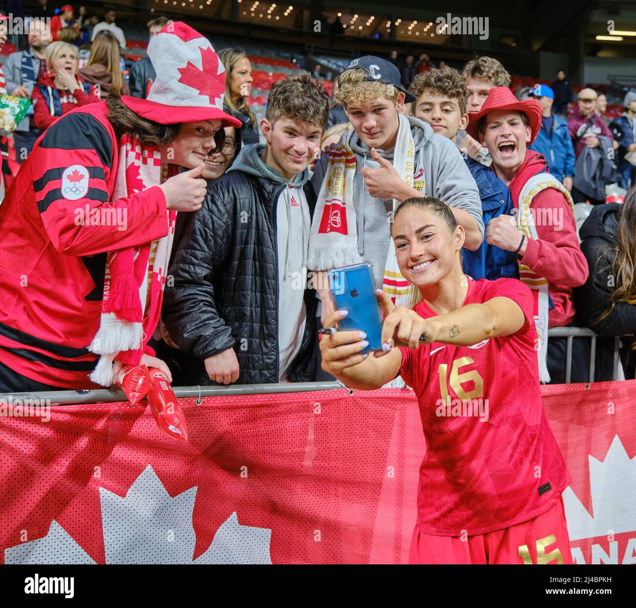 Vancouver, British Columbia, Canada. 8th April, 2022. Janine Beckie of Team Canada taking selfie with fans after the first Canada Soccer’s Women’s Nat Stock Photo