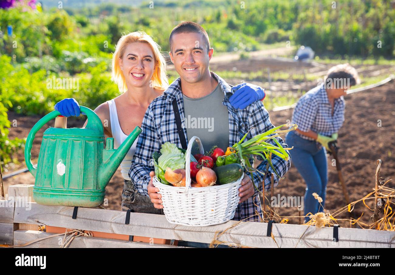 Happy family couple gardeners hi-res stock photography and images - Alamy