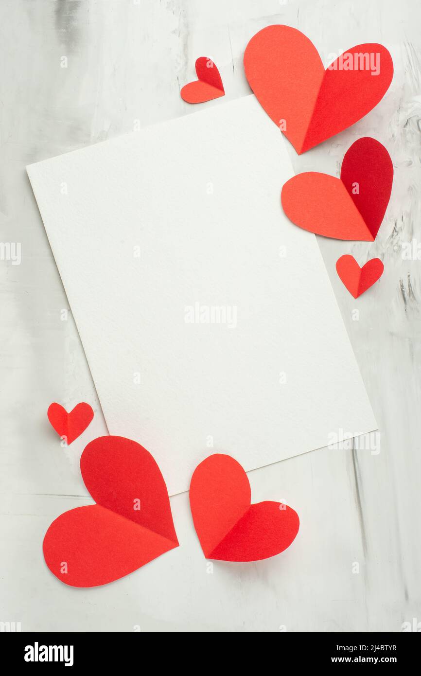 Valentine background with red hearts and white postcard for design on a ...