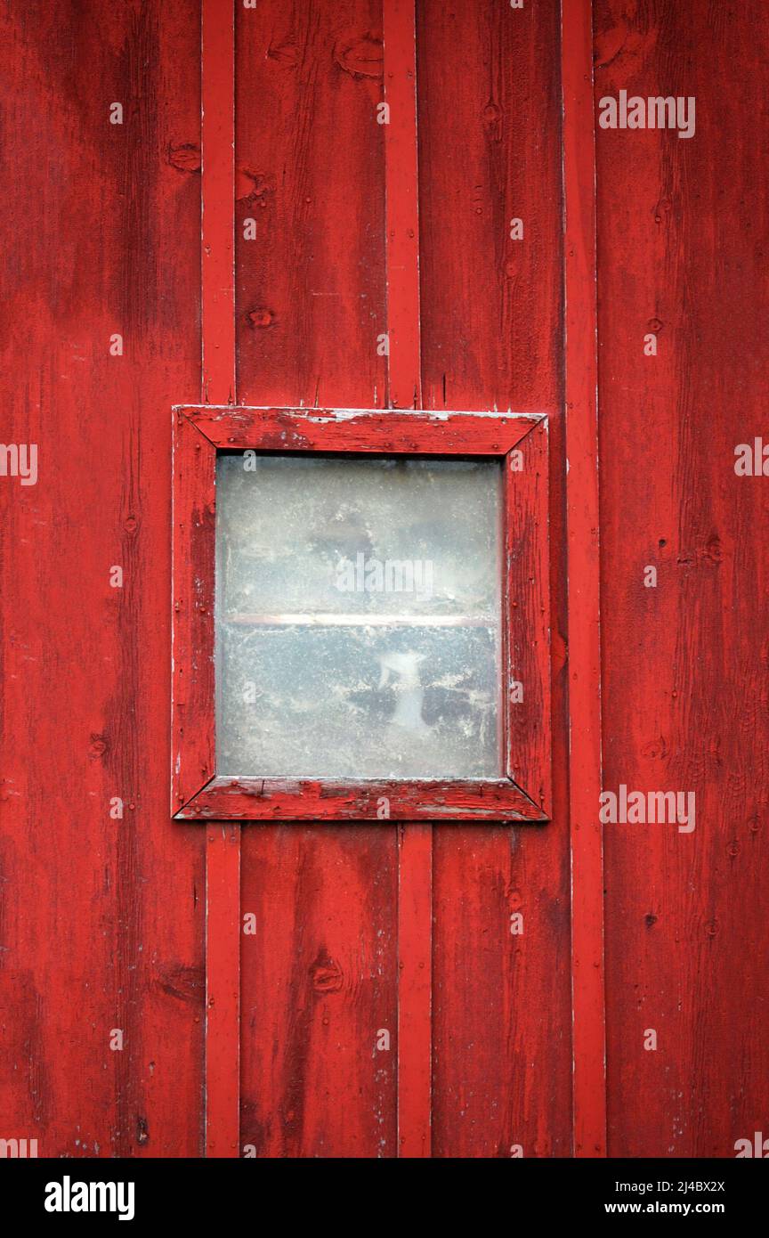 Dirty old window on red wooden wall Stock Photo - Alamy