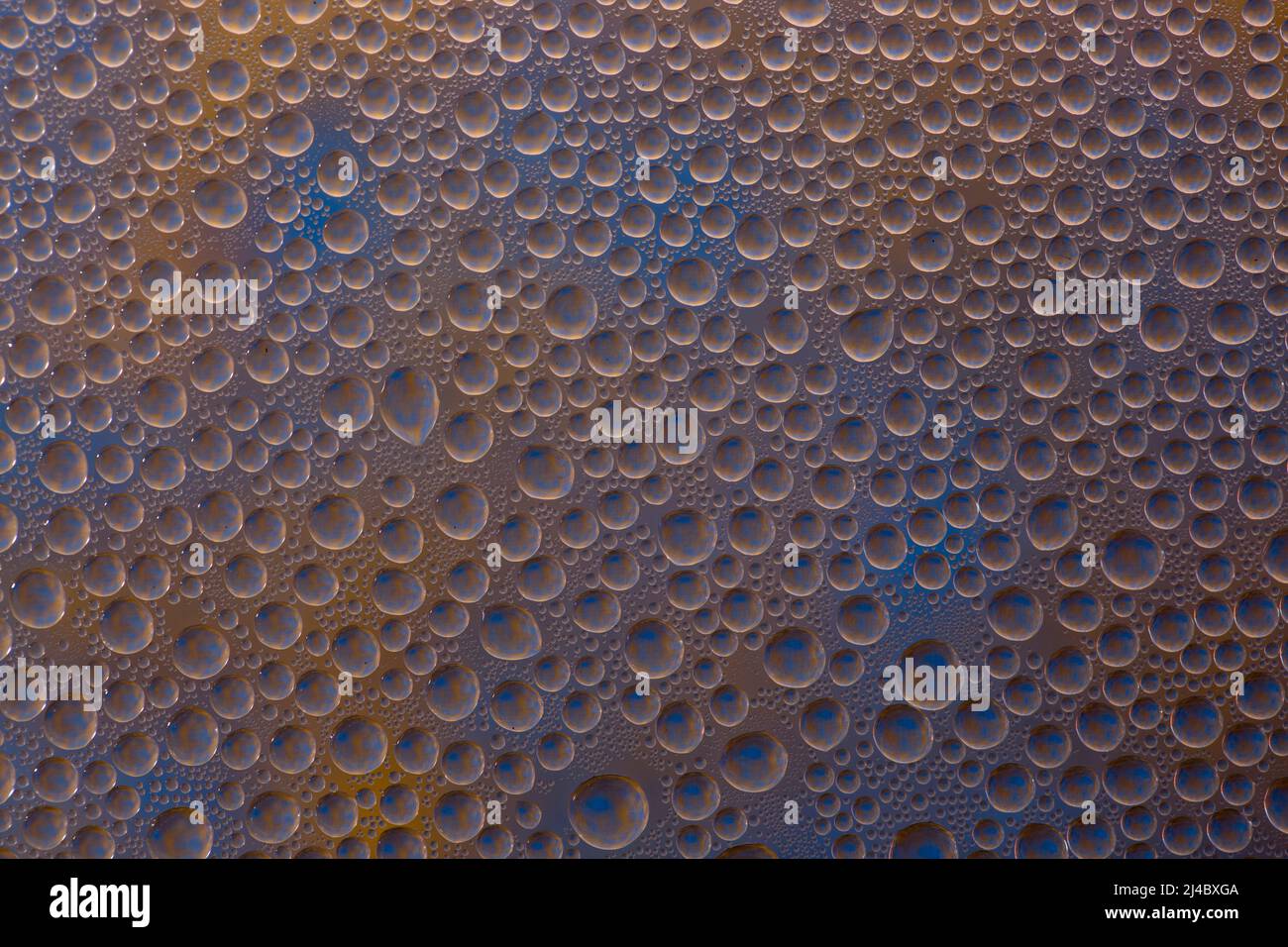 Abstract background of water droplets on the glass surface Stock Photo