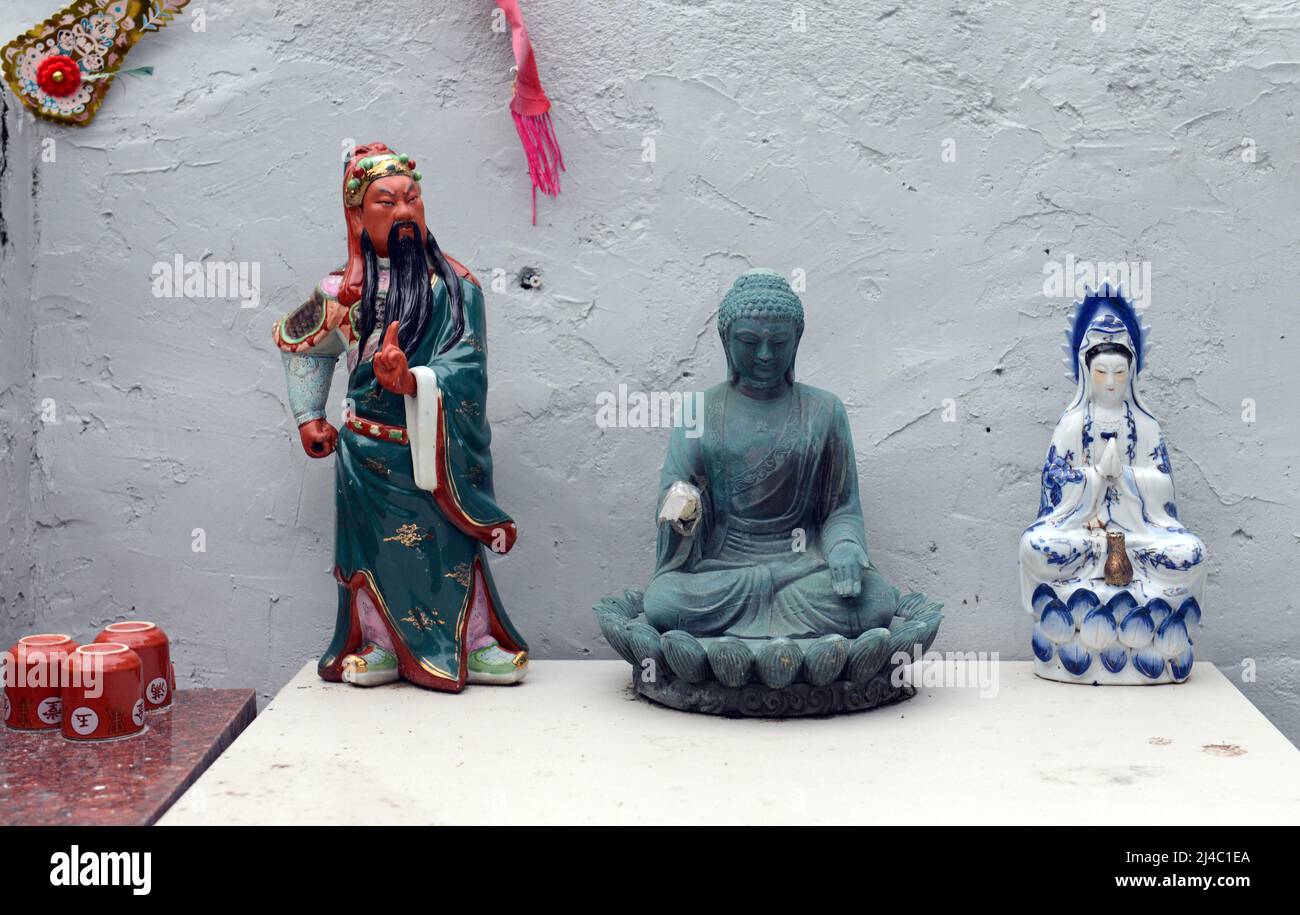 Statues of traditional Chinese religious figures in a small temple in Pui O, Lantau Island, Hong