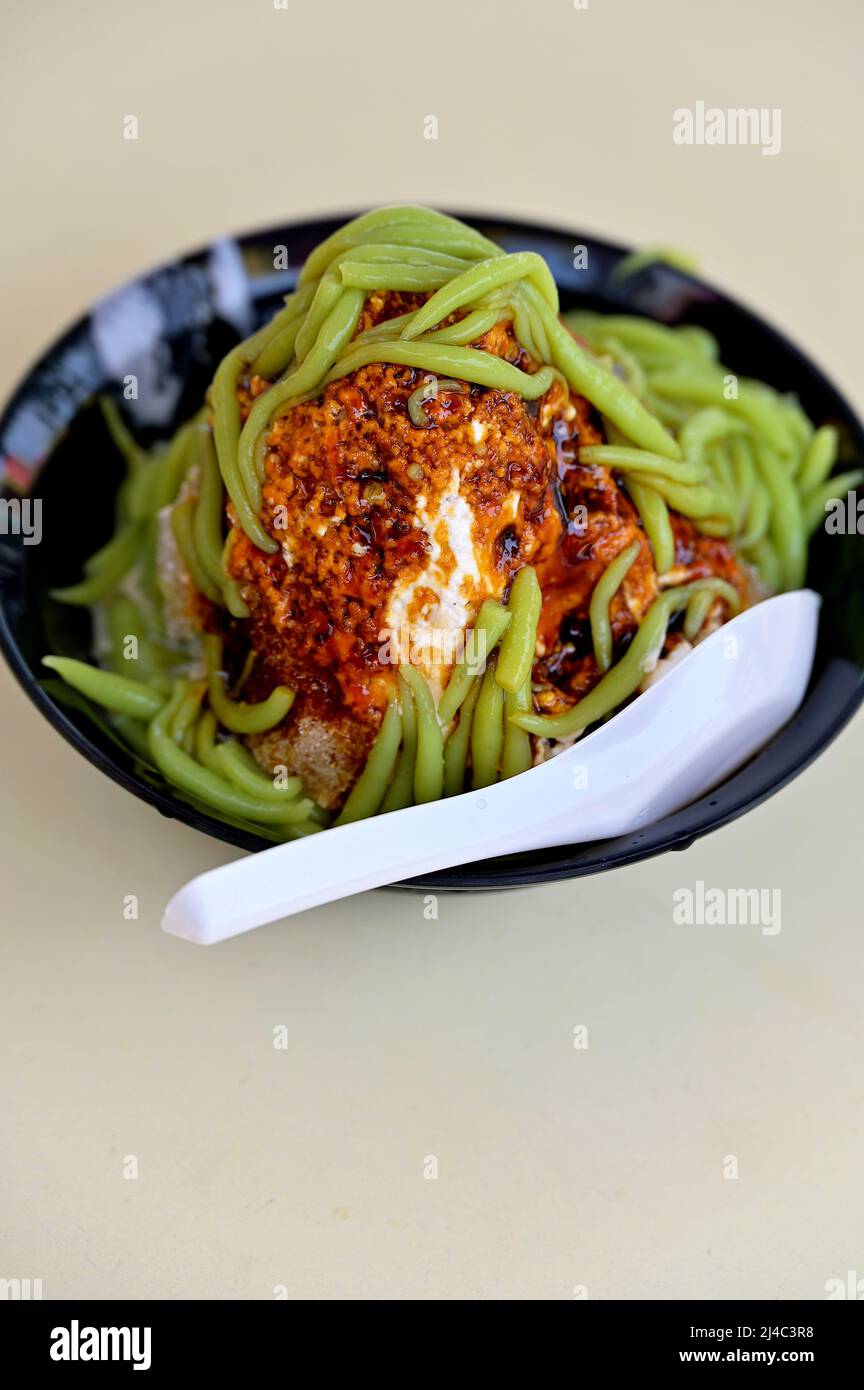 Cendol is a sweet dessert made with shaved ice and green rice flour