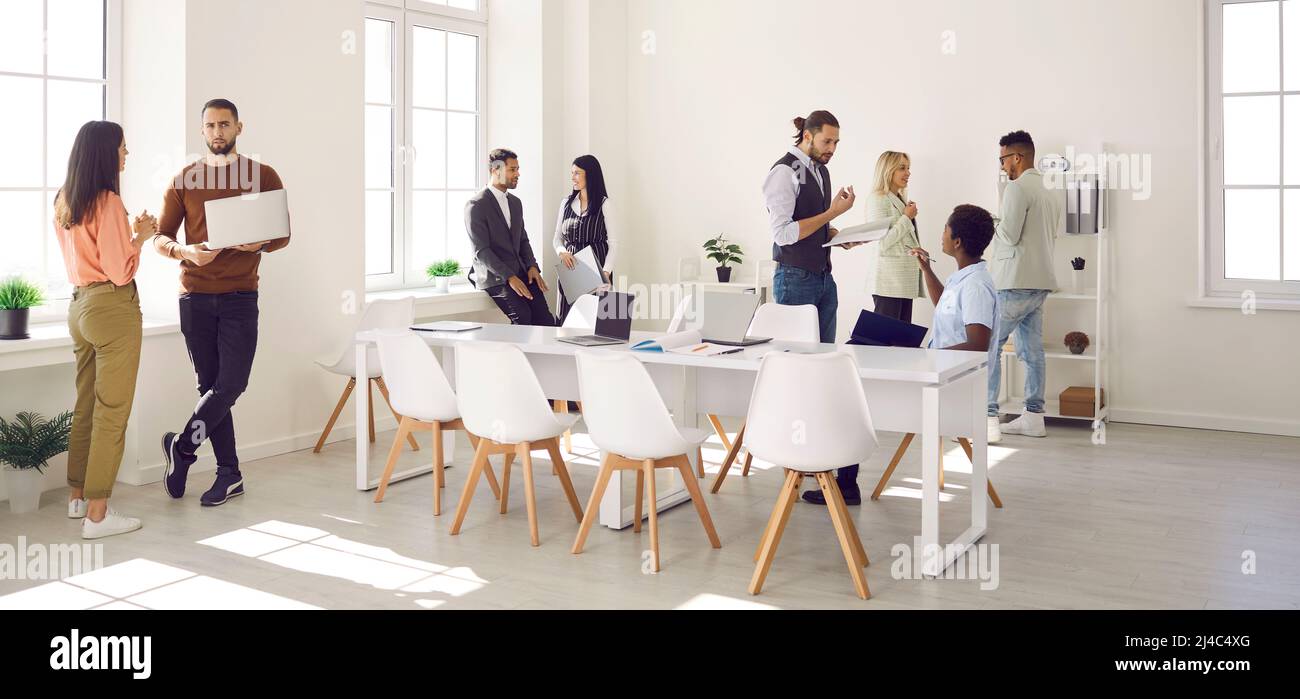 Young diverse business professionals working together in a modern company office Stock Photo