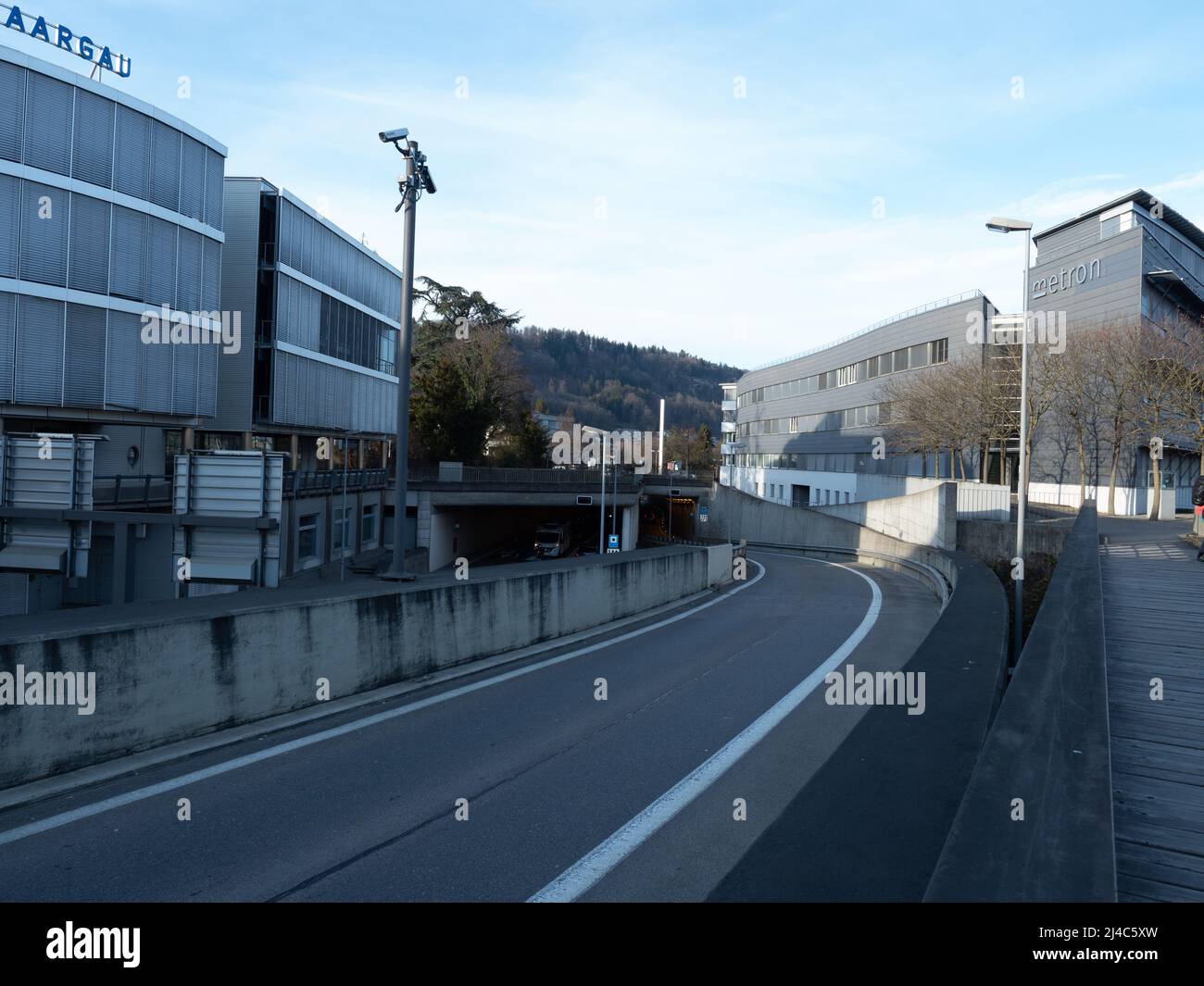 Brugg, Switzerland - March 13th 2022: Road infrastructure and business buildings in the city centre. Stock Photo