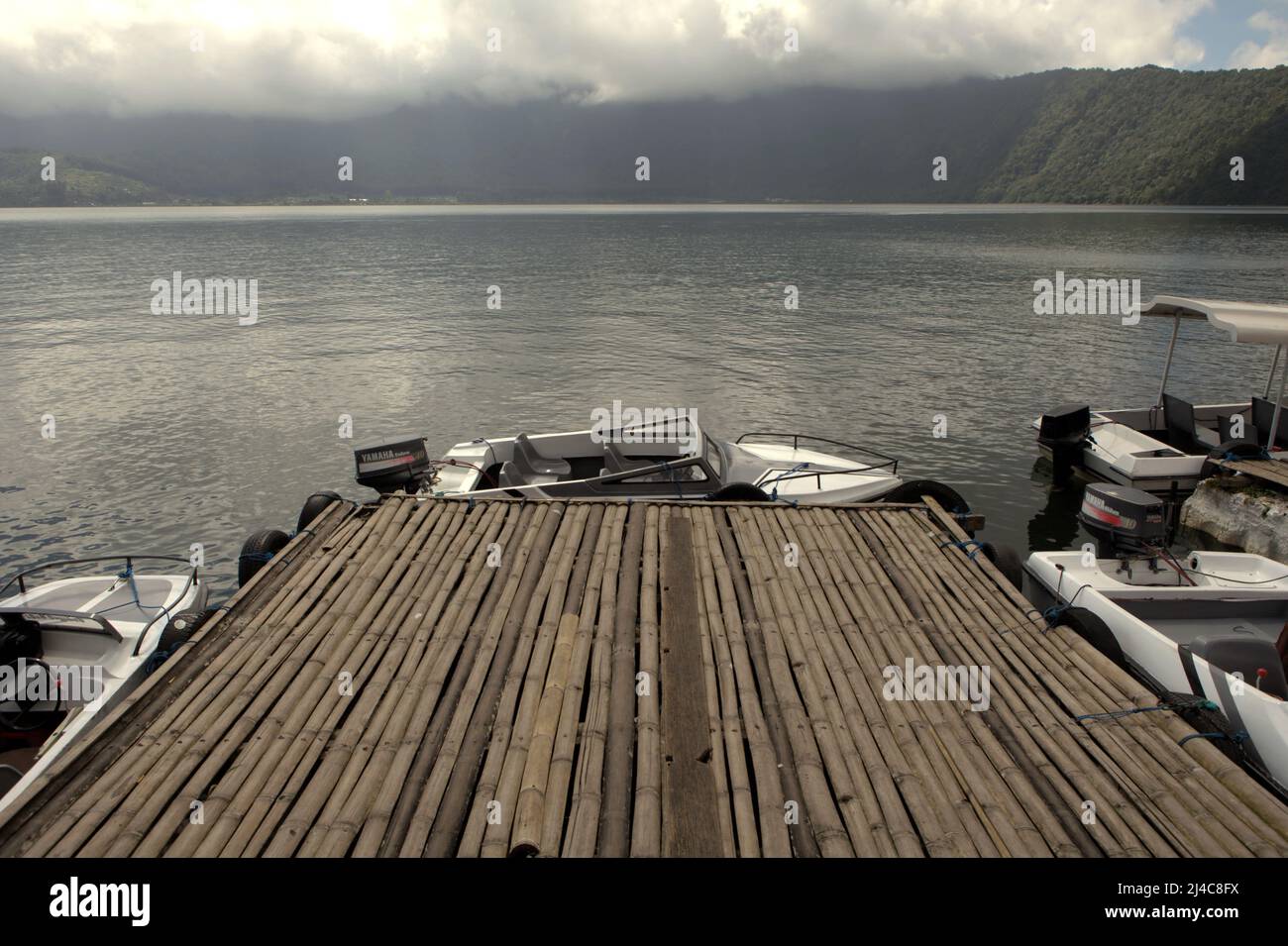 Bratan lake jetty at Bedugul water sport recreational area in Bedugul, Tabanan, Bali, Indonesia. Bratan lake is one of the four lakes—along with Buyan, Tamblingan and Batur—that are supporting the lives of Balinese people. Stock Photo