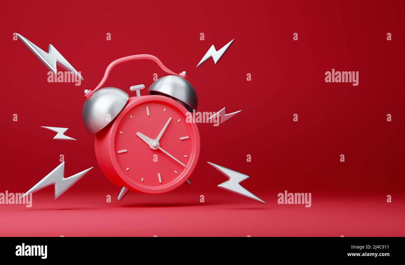 Red vintage ringing alarm clock with silver lightings Stock Photo - Alamy