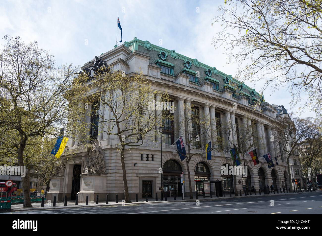 Australia House on Strand, London, England, UK. In solidarity with Ukraine the Ukrainian national flag displayed prominent above the main entrance. Stock Photo
