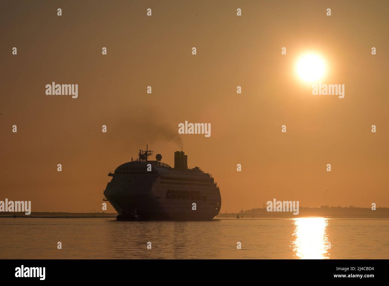 Gravesend Kent UK 14th April 2022. The Cruise ship Ambience arrives at the London International Cruise Terminal on the River Thames at Tilbury ahead of it's maiden voyage for the new UK based cruise line Ambassador who have their HQ in Purfleet Essex. Delayed by two weeks because of fuel supply issues from Croatia where she was refitted after she was purchased from P&0 Cruises Australia where she was then known as the Pacific Dawn. Credit: MARTIN DALTON/Alamy Live News Stock Photo