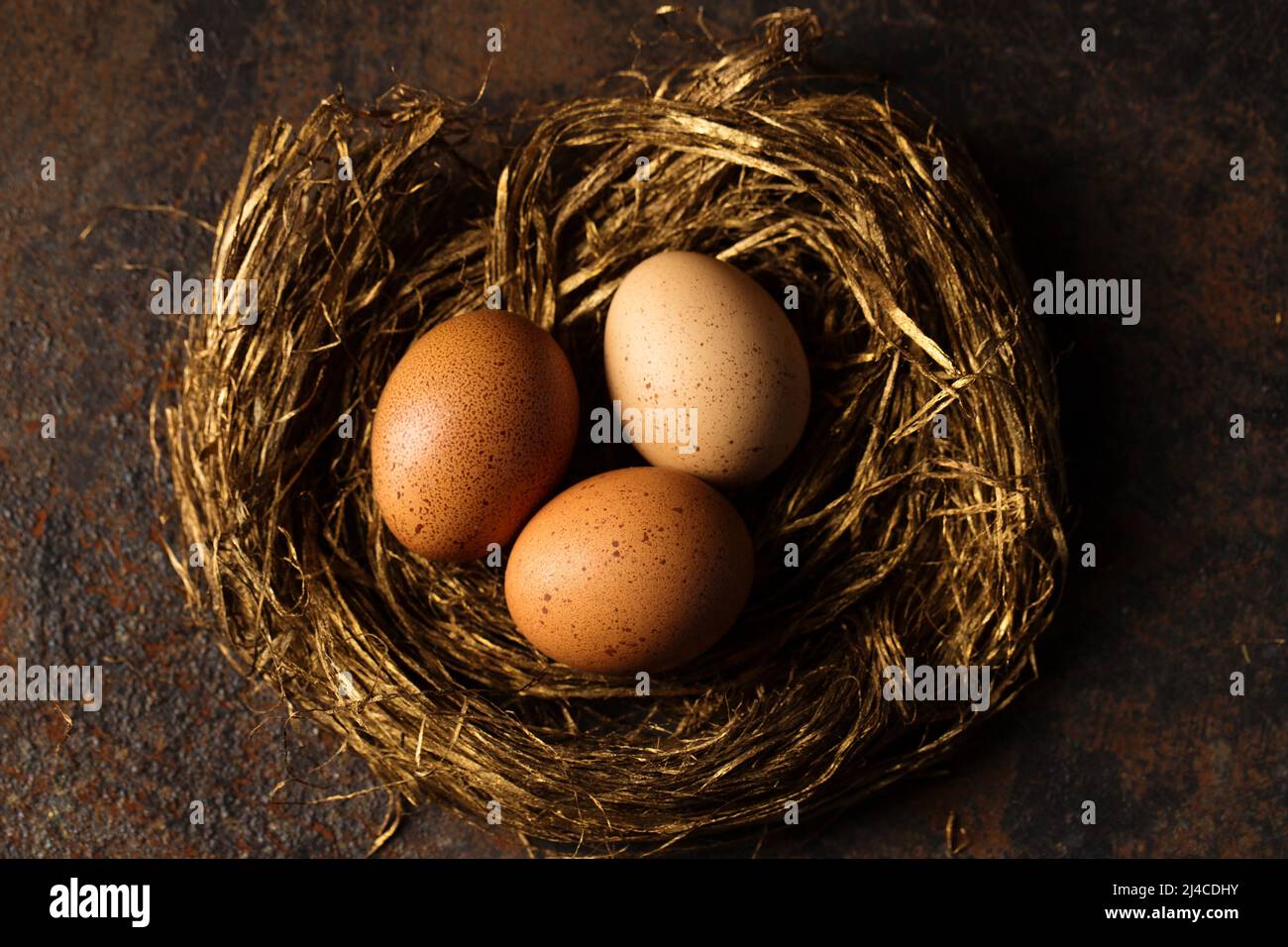 big-red-eggs-in-a-golden-nest-photo-in-rustic-style-stock-photo-alamy