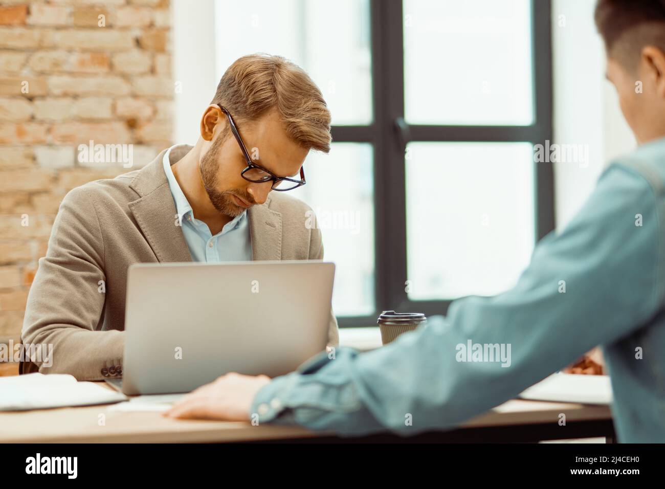 Two young men working together with new project Stock Photo
