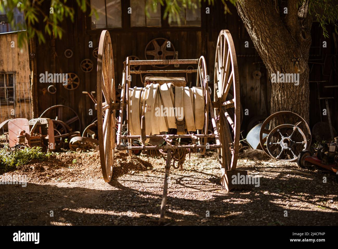 Fire water hose on an old west wagon cart Stock Photo