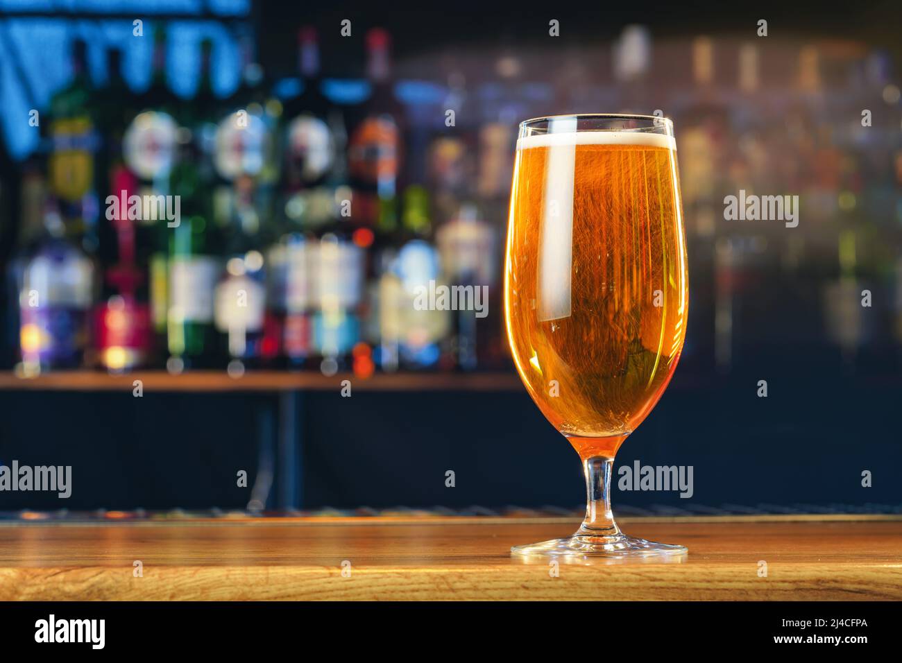 Fresh cold beer in glass on bar background Stock Photo Alamy