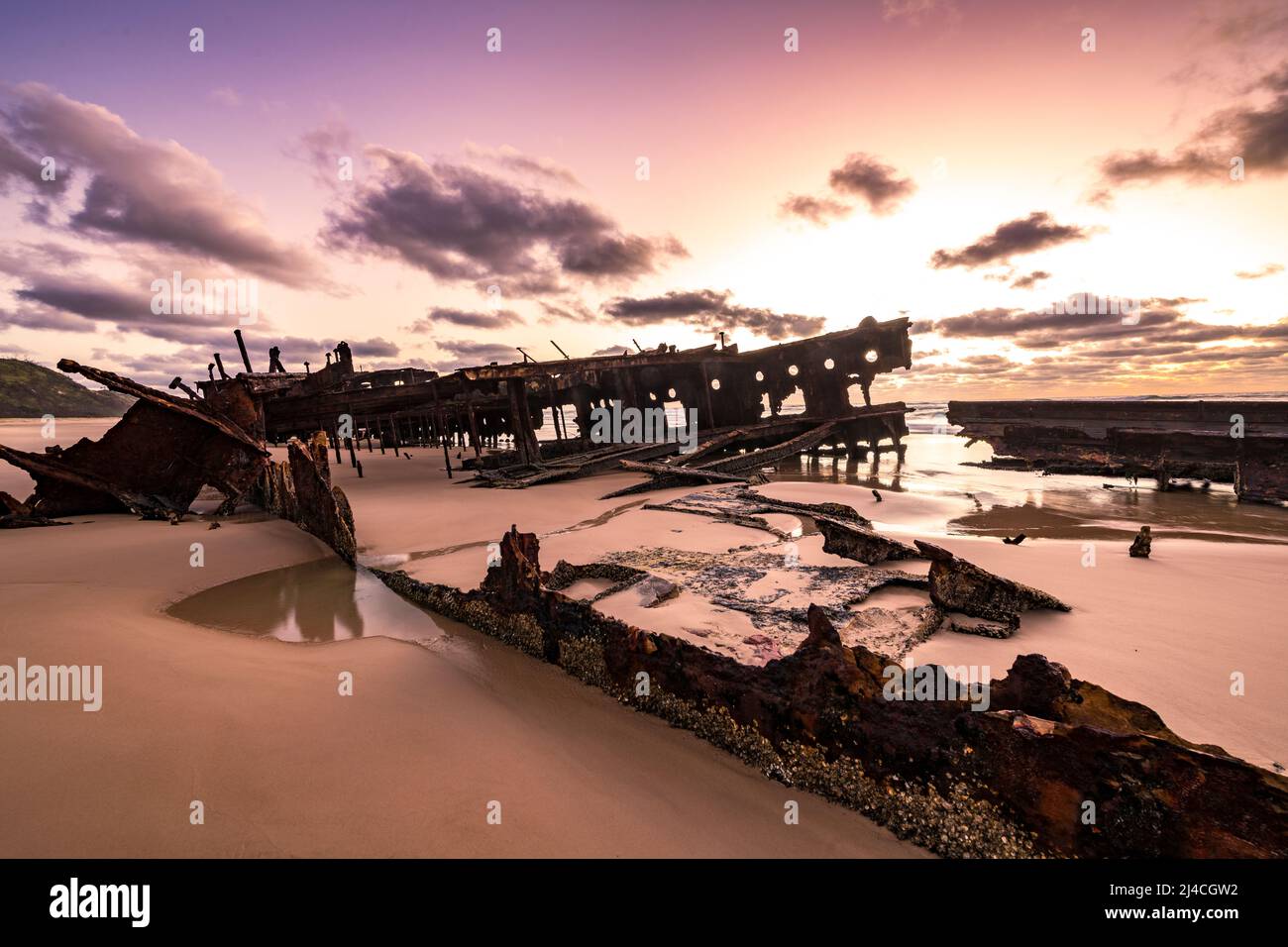 Maheno shipwreck at sunrise on Seventy Five Mile Beach on Fraser Island, Queensland, Australia Stock Photo