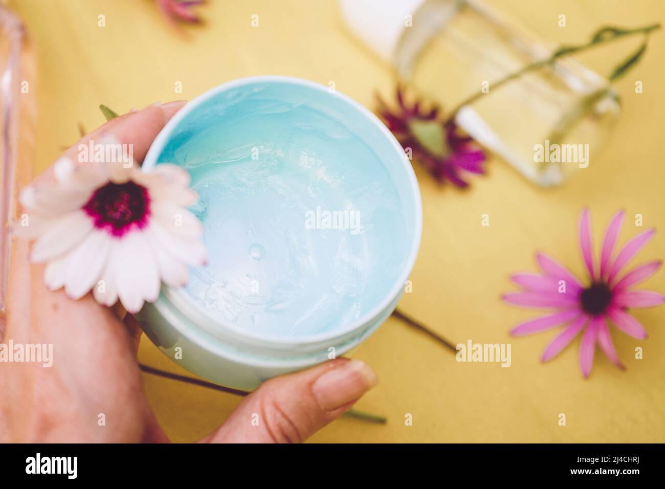 Still life of eco cosmetics with fresh flowers Stock Photo