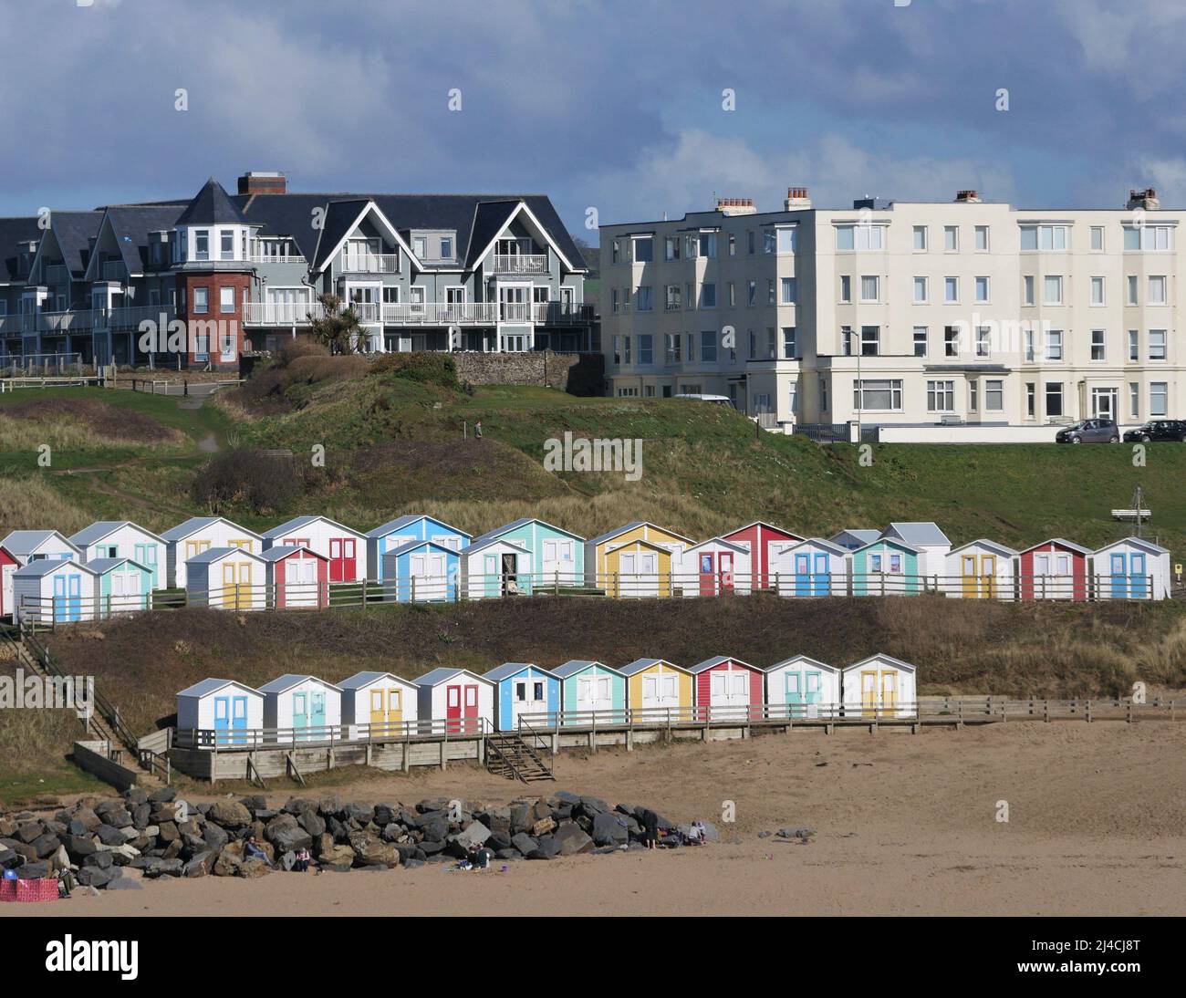 Colourful beach huts for hire on Summerleaze Beach Stock Photo