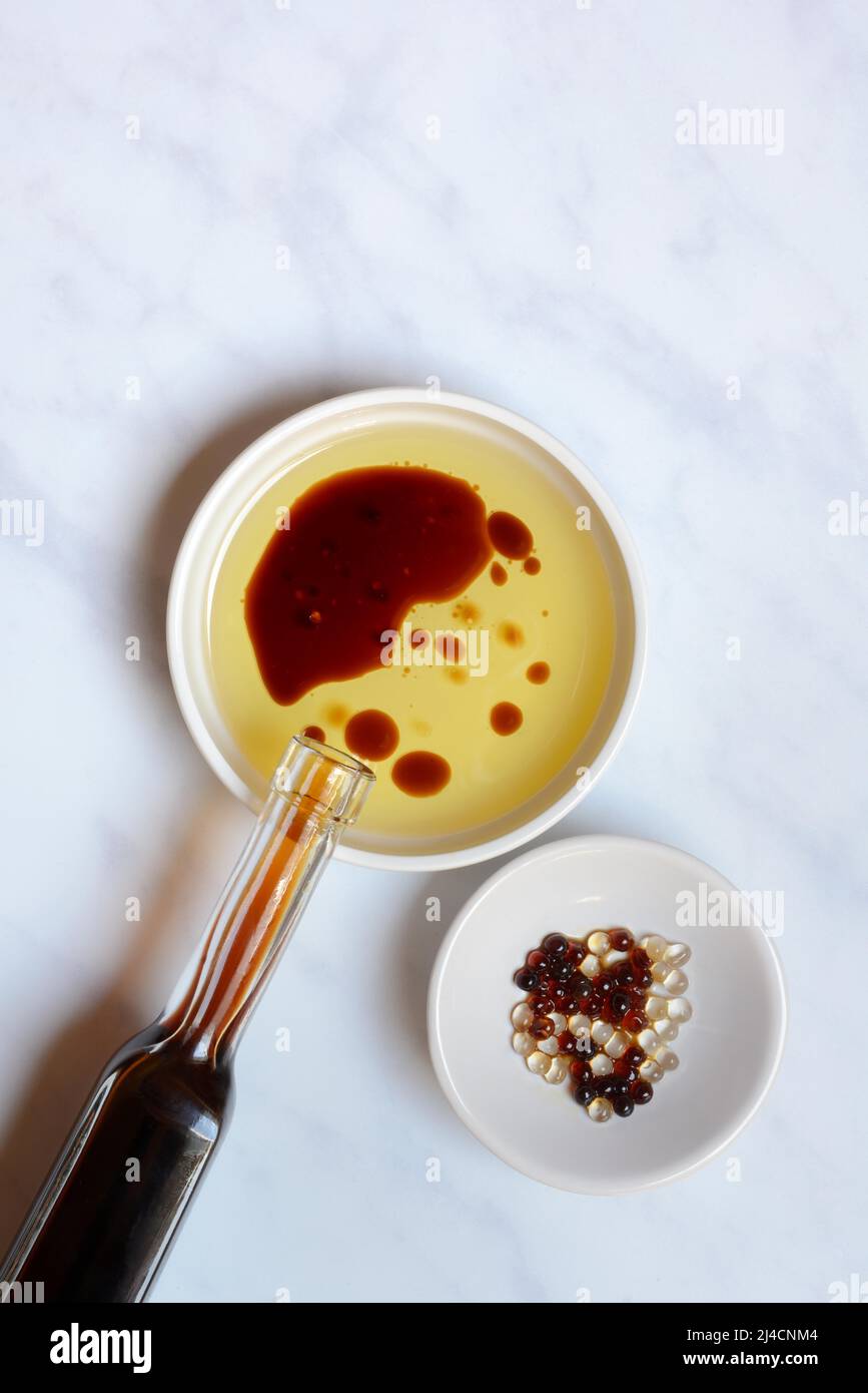 Bowl with cooking oil and aceto balsamico, bowl with aceto pearls Stock ...