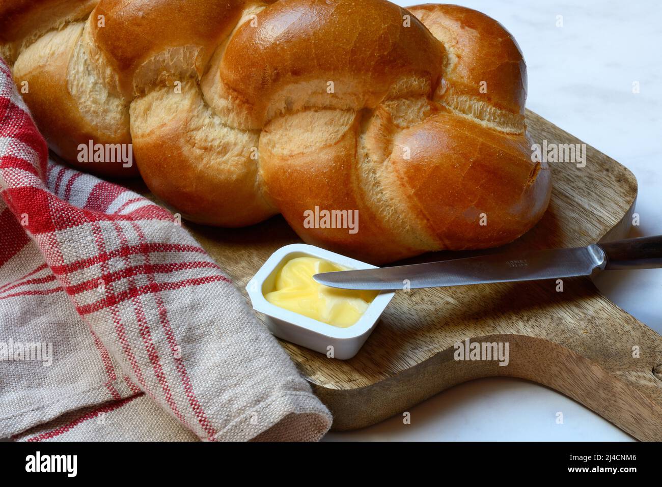 Butter in portion packs and butter plait Stock Photo Alamy