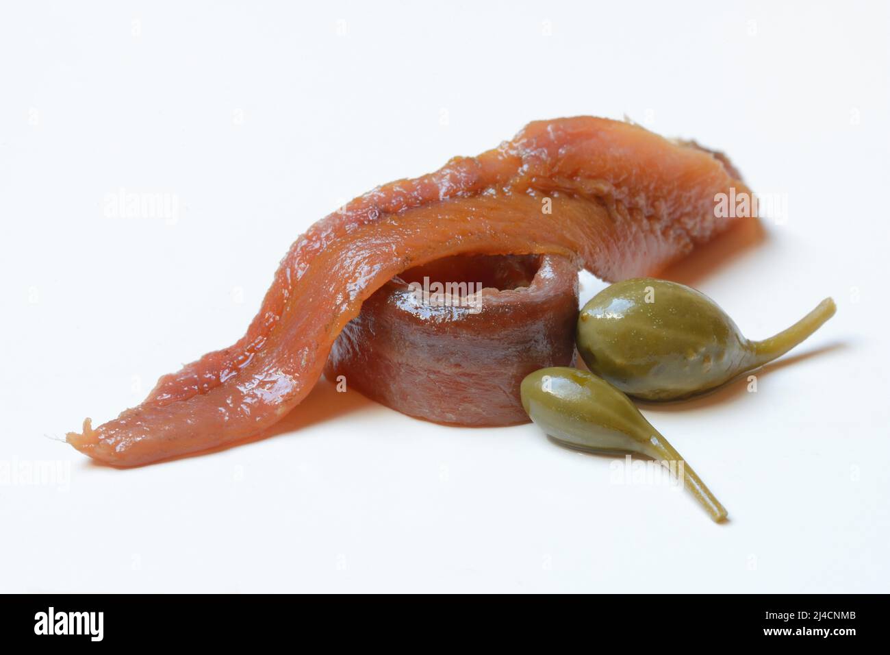 European anchovy (Engraulis encrasicolus), anchovy fillets and caper apples Stock Photo