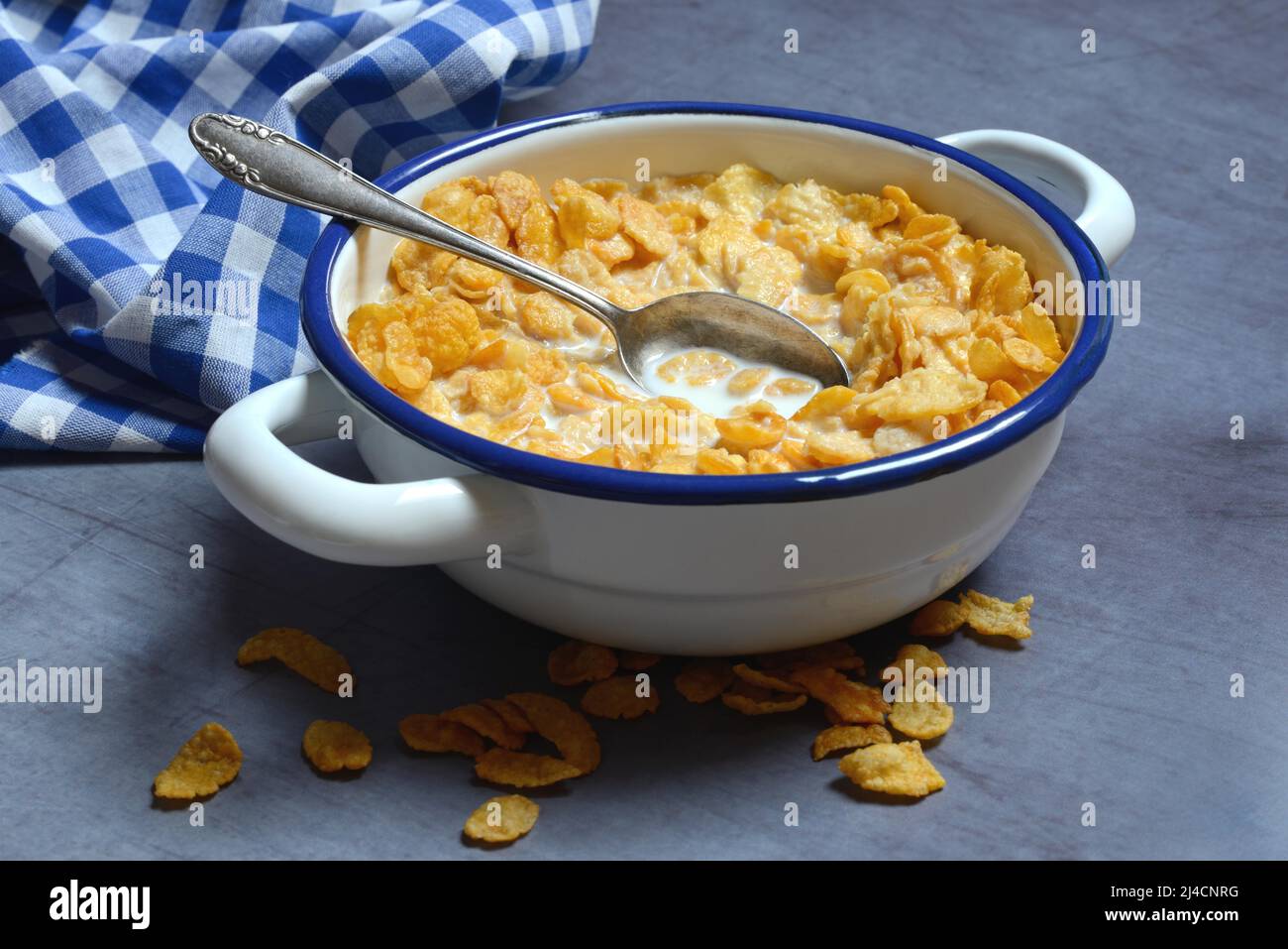 Cornflakes with milk in bowl, breakfast Stock Photo