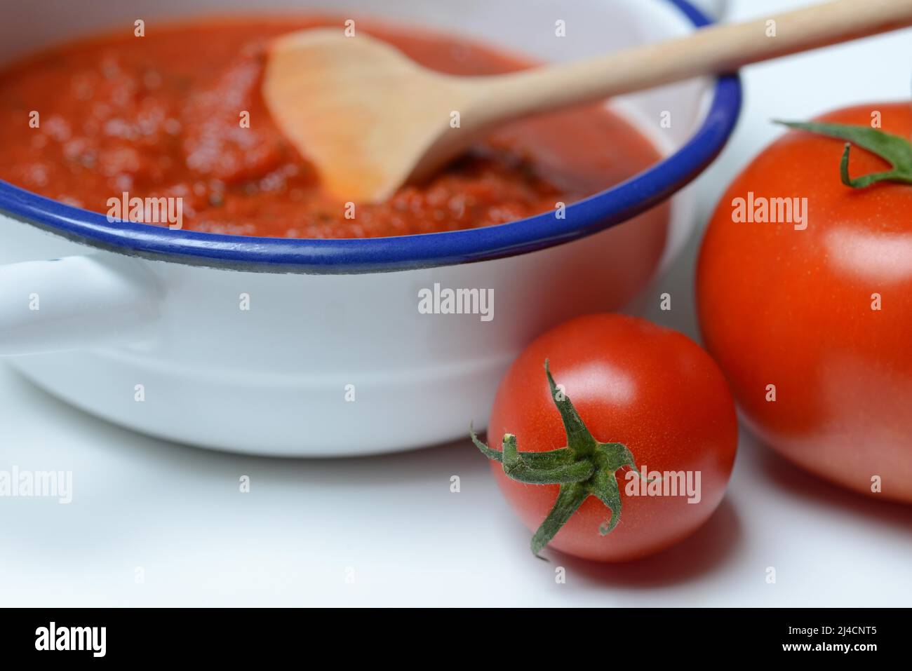 Tomatoes and peel with tomato sauce, sugo, pasta sauce Stock Photo Alamy