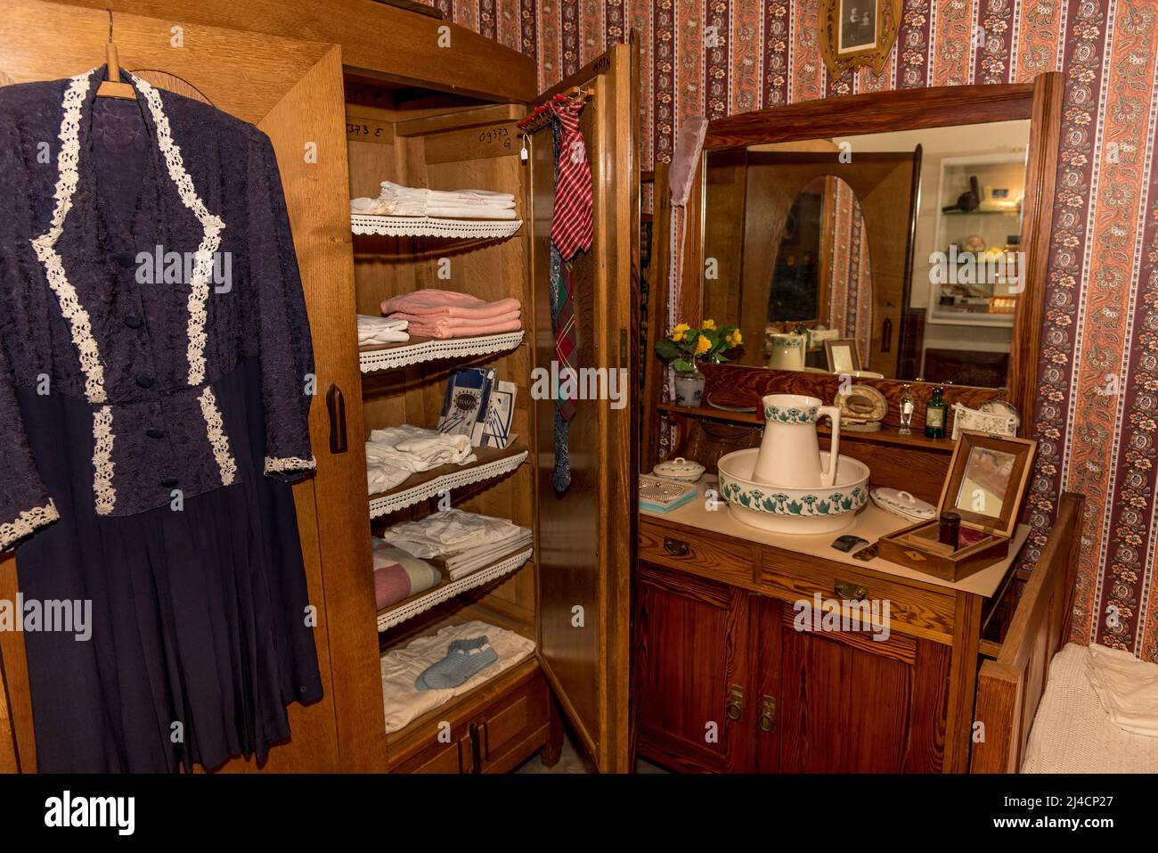 Hoorn, Netherlands, March 2022. Old-fashioned wardrobe and coat rack in a Dutch house. High quality photo Stock Photo