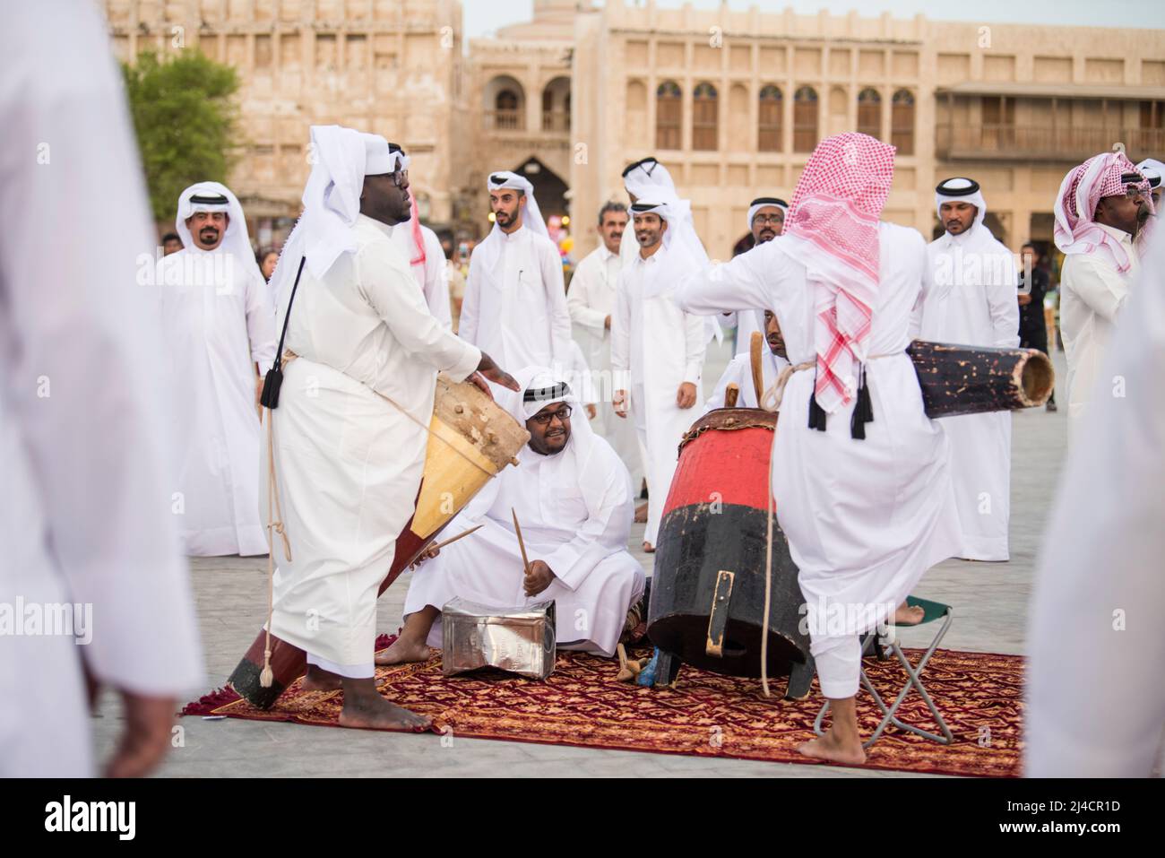 Doha,Qatar - April 22,2022: The performance of traditional Qatari music and dance is performed by local people in old bazaar market Souk Waqif. Stock Photo
