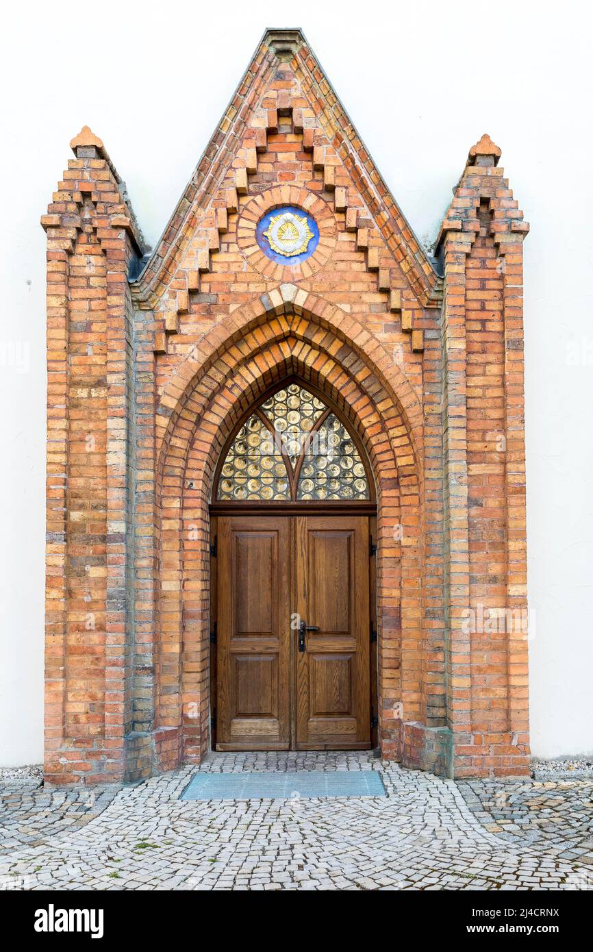 Portal at St. John's Church with the symbol of the Trinity, Hoyerswerda, Saxony, Germany Stock Photo