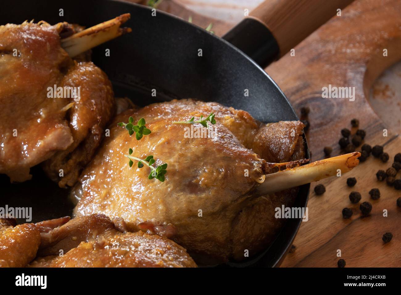 duck confit cooked in a dish Stock Photo Alamy
