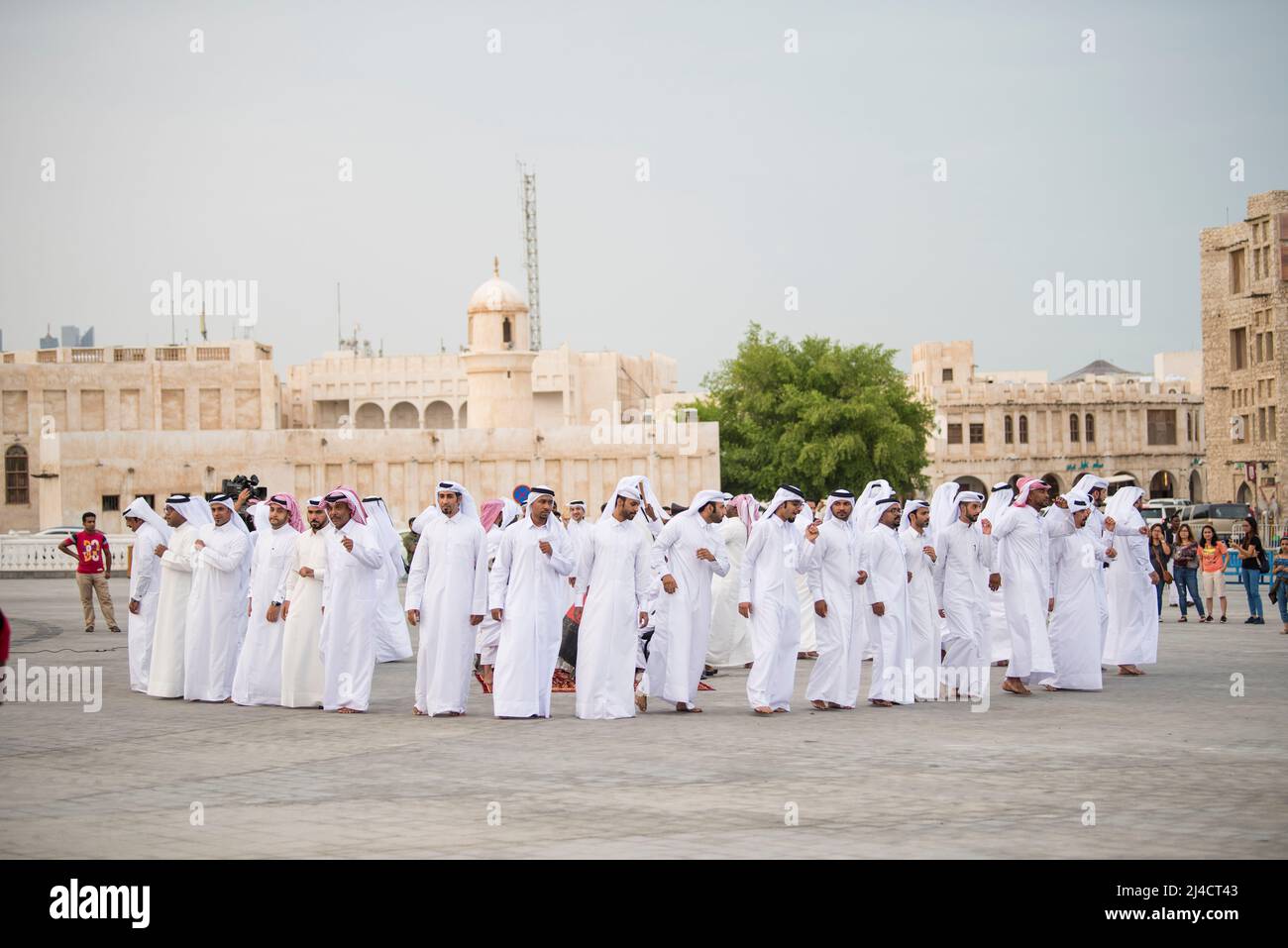 Doha,Qatar - April 22,2022: The performance of traditional Qatari music and dance is performed by local people in old bazaar market Souk Waqif. Stock Photo