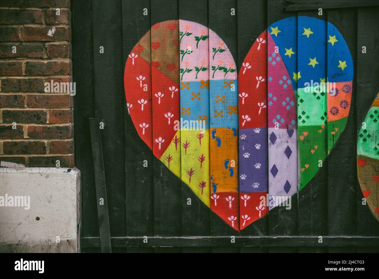 Shoreditch, London, UK - April 14, 2016: Colourful street art rendition of a heart, captured in Shoreditch, East London. Stock Photo
