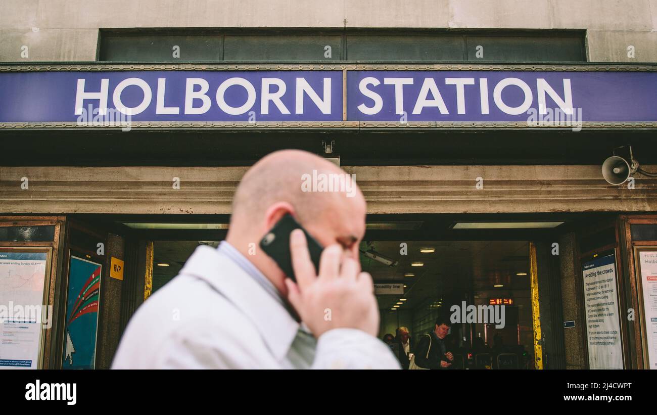 Holborn, London, UK - April 12 2016: The entrance to Holborn Underground Station, with an unrecognisable commuter outside. Stock Photo