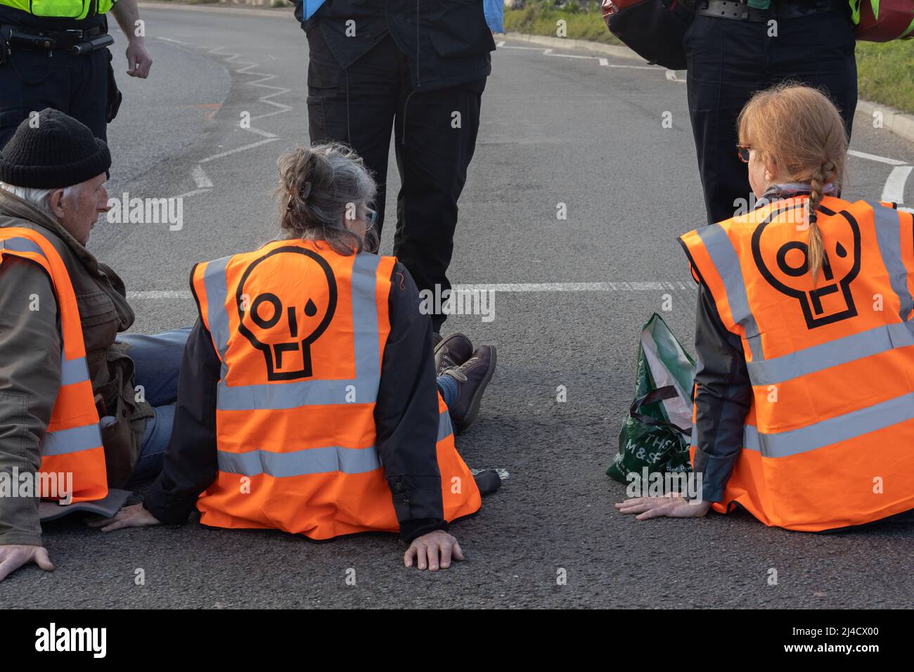 Thurrock, Essex, UK 13 April 2022 Just Stop Oil protesters block a major roundabout climbing