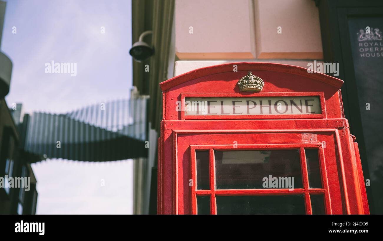 Covent Garden, London, UK - April 12, 2016: A classic red telephone box, captured in touristy Covent Garden. Stock Photo